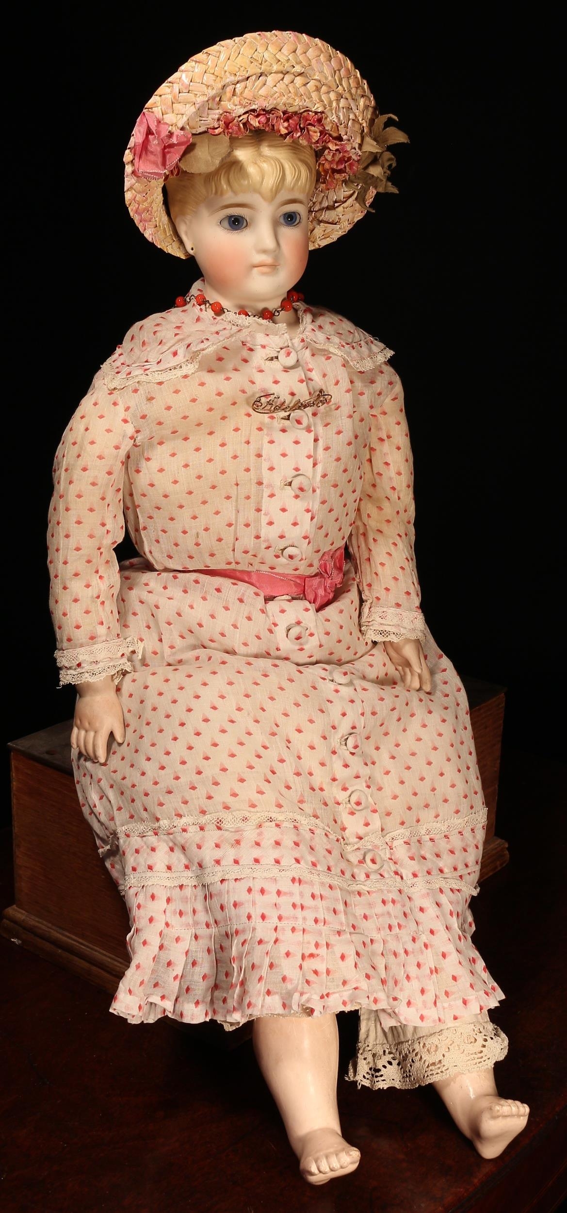 A late 19th century German bisque shoulder head doll, attributed to Christian Friedrich Kling, the bisque shoulder head with fixed inset blue glass eyes, painted features including feathered brown eyebrows, fine eyelashes, red lips and blush red cheeks, blonde moulded hair, pierced ears, partially stuffed cloth body with bisque lower arms and painted composition lower legs, impressed marks '148', 60cm high