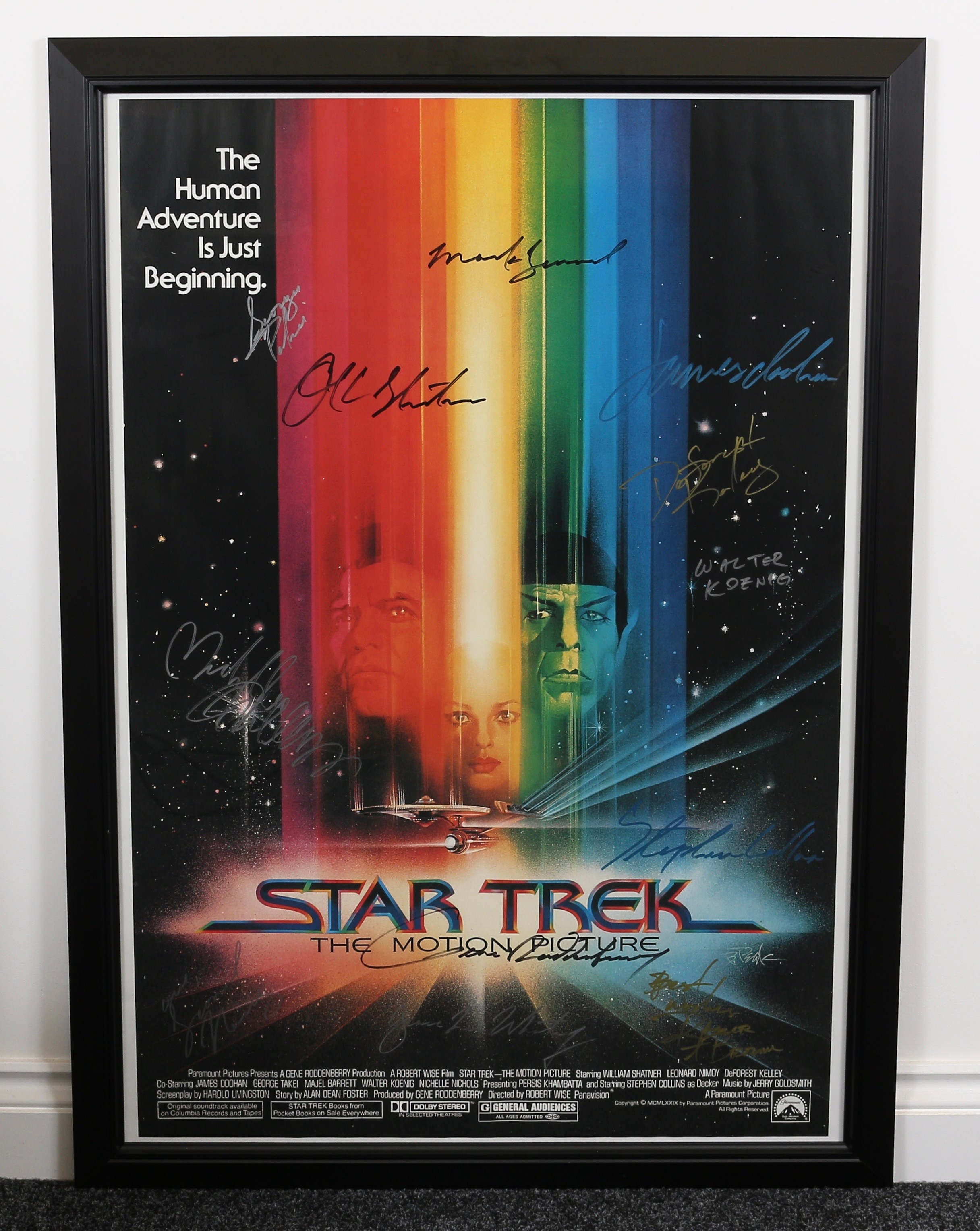 Poster, Film, Cinema & Movie Interest, Autographs - a rectangular shaped poster for Star Trek the motion picture, signed in pen, various signatures including William SHATNER, Leonard NIMOY, DeForest KELLEY, James DOOHAN, George TAKEI, Walter KOENIG, Stephen COLLINS, Grace Lee WHITNEY, Mark LENARD, Roger Aaron BROWN, Nichelle NICHOLS and Gene RODDENBERRY, framed with certificate of authenticity, 96cm high, 66cm wide (measurements excluding frame)