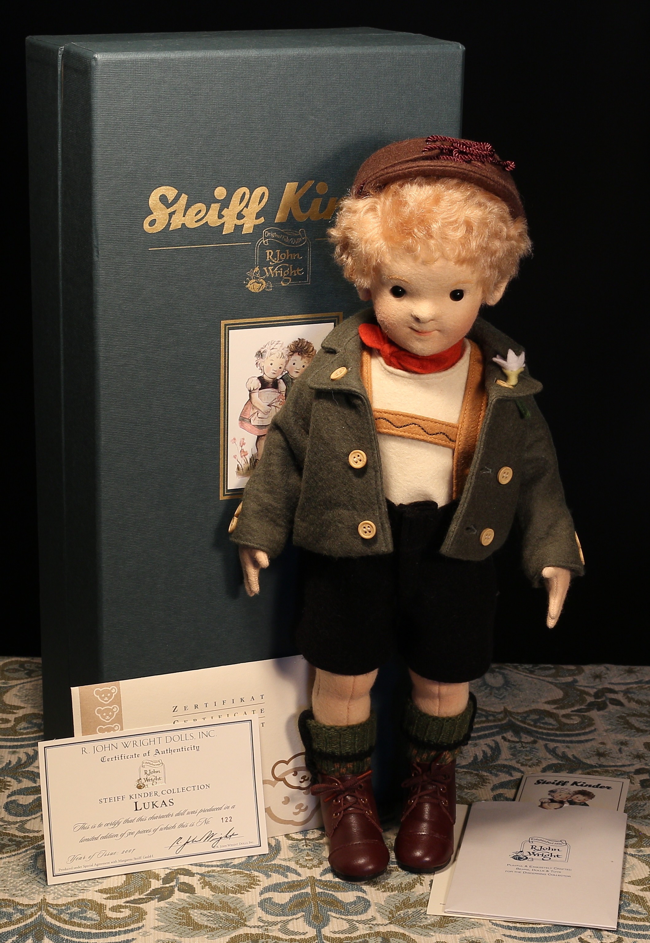 Steiff (Germany) EAN 710223 R.John Wright Steiff Kinder Collection Lukas felt doll, trademark 'Steiff' button to ear, RJW button to shorts with tag, 42cm high, boxed with certificate, literature and outer cardboard box with sleeve, Limited Edition No.00122 of 500