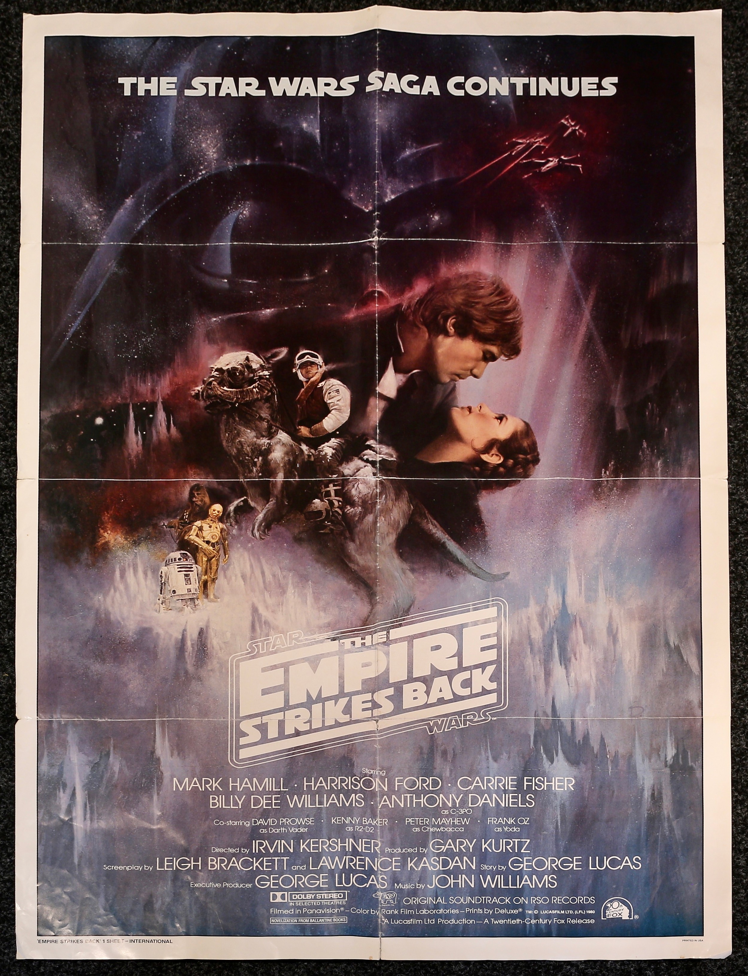 Poster, Sci-Fi, Film, Cinema & Movie Interest - a Star Wars The Empire Strikes Back one sheet rectangular shaped poster, 'THE STAR WARS SAGA CONTINUES', 'EMPIRE STRIKES BACK, 1 SHEET - INTERNATIONAL' and 'PRINTED IN USA' to lower corner, 104cm high, 68.5cm wide, unframed