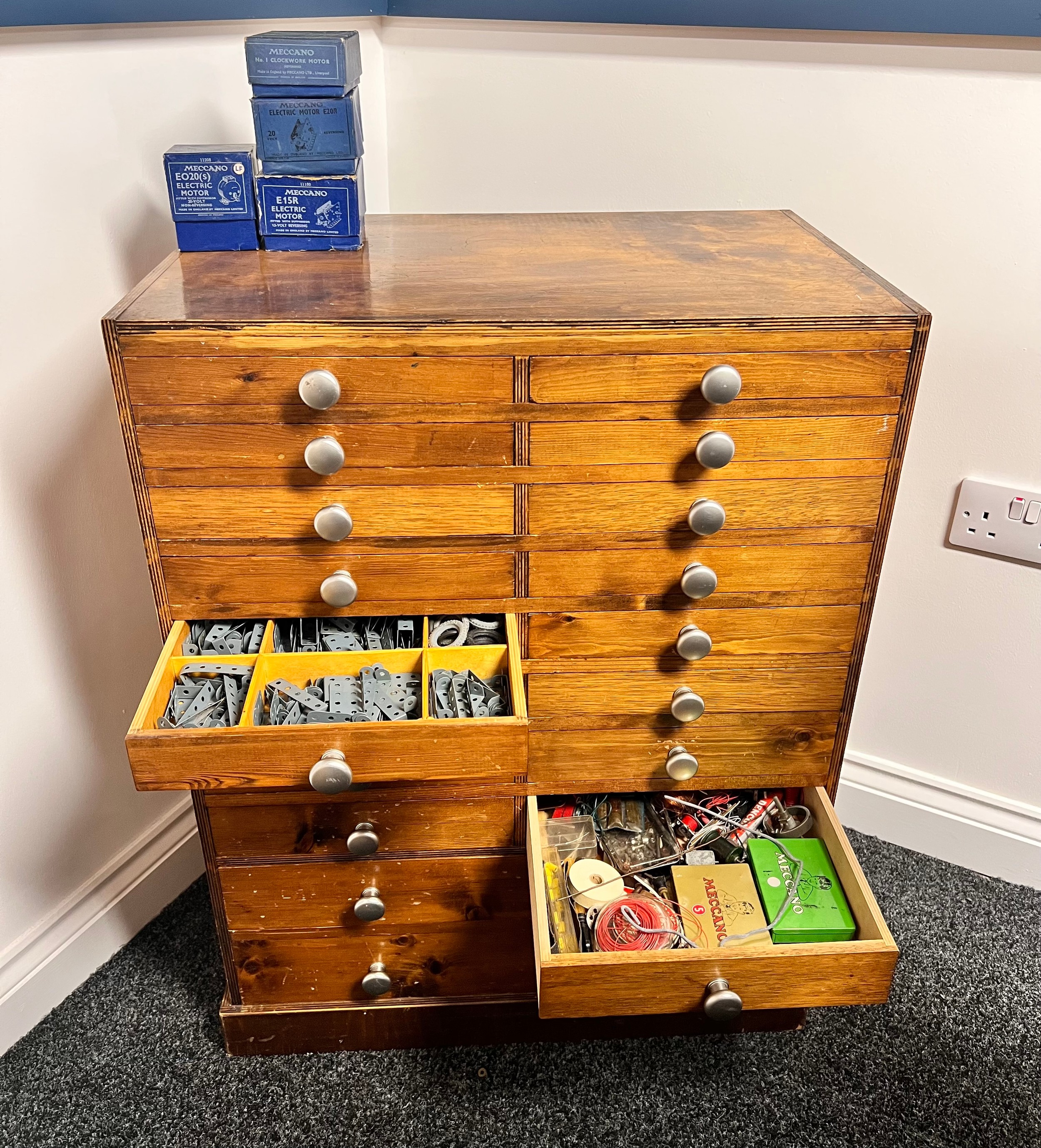 Model Engineering & Construction - a large collection of Meccano components, parts and accessories, housed in a bespoke wooden engineers chest of drawers or cabinet; various volumes of Meccano magazines (quantity)