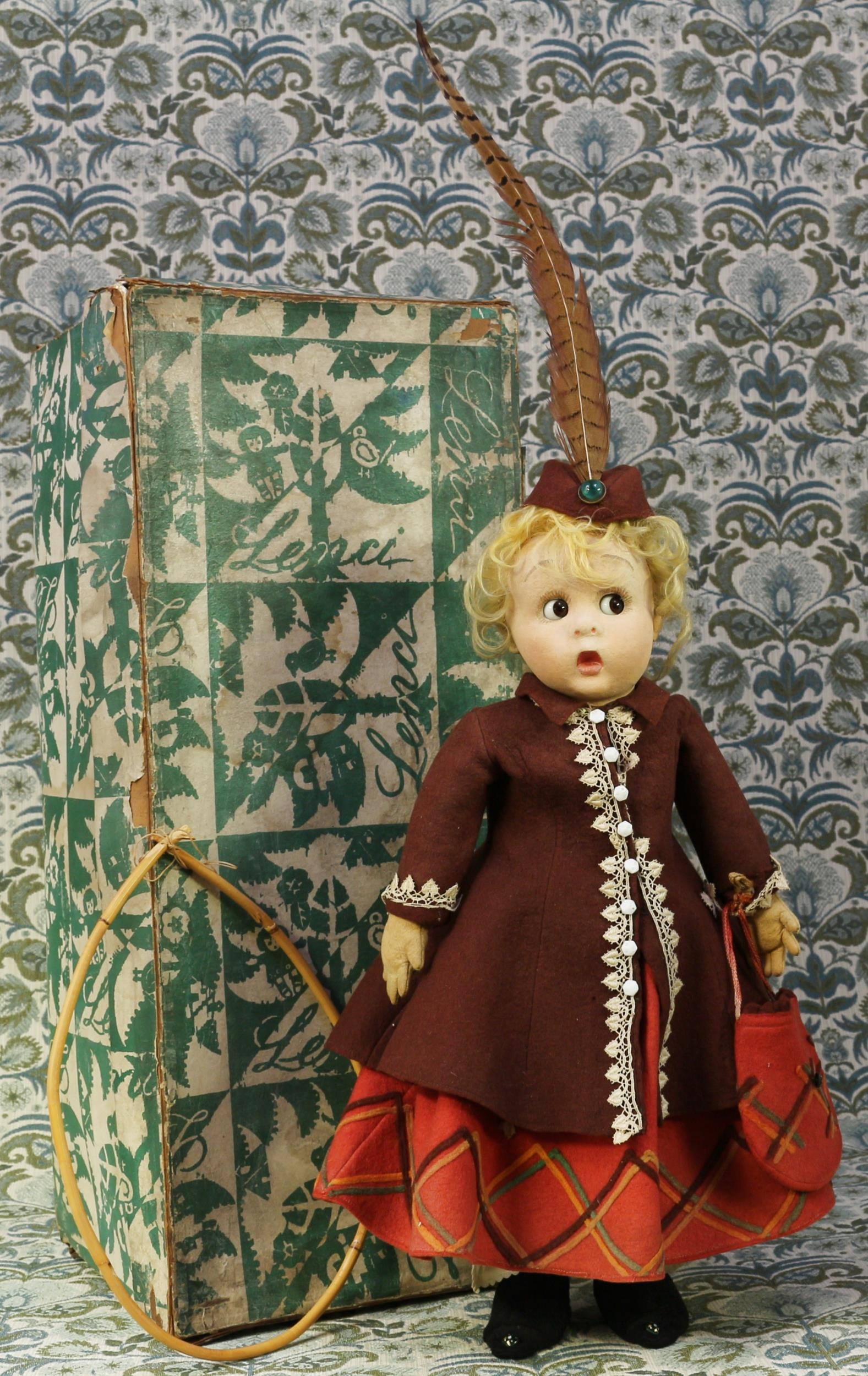 A 1930's Lenci (Italy) felt costume character doll, the pressed felt head with inset side glancing brown glass eyes, painted features including brown eyebrows and eyelashes, blonde hair, wearing original costume, 51cm high, boxed with hoop for petticoat