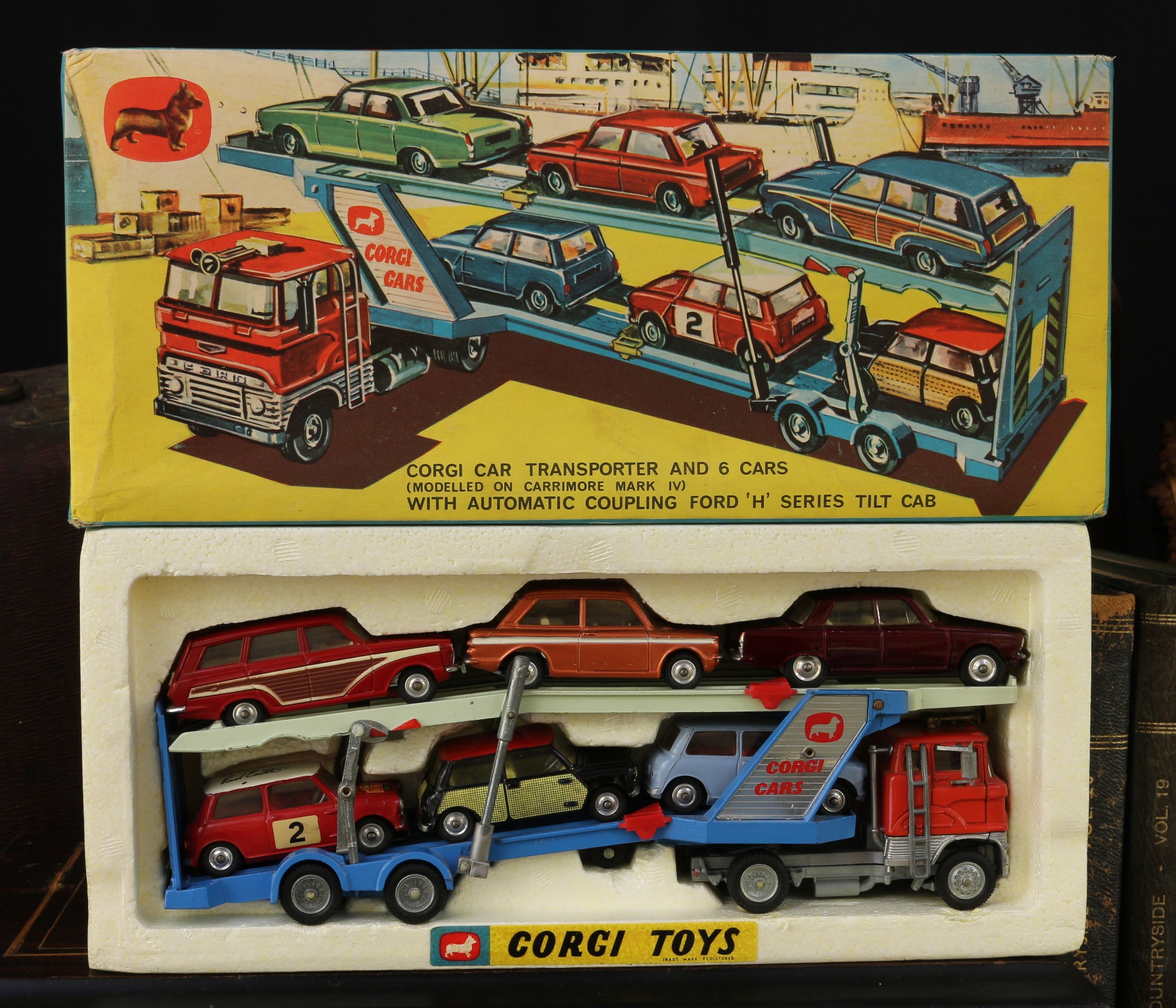 Corgi Toys Gift set 41, comprising 1138 Carrimore car transporter with Ford tilt cab, orange cab with two tone blue transporter; 252 Rover 2000, metallic maroon body with cream interior, spun hubs; 251 Hillman Imp, metallic bronze body with white flashes, cream interior, spun hubs; 440 Ford Consul Cortina super estate car, red body with faux side panels, cream interior, spun hubs; 226 Morris Mini-Minor, pale blue body, red interior, spun hubs; 321 Mini Cooper 'S', red body with white roof, Monte Carlo decals and racing number '2' to side doors, red interior, spun hubs; 249 Morris Mini Cooper DeLuxe, black body with faux 'wickerwork' side panels and red roof, lemon yellow interior, spun hubs, boxed  *This Gift set was previously only sold by mail order.