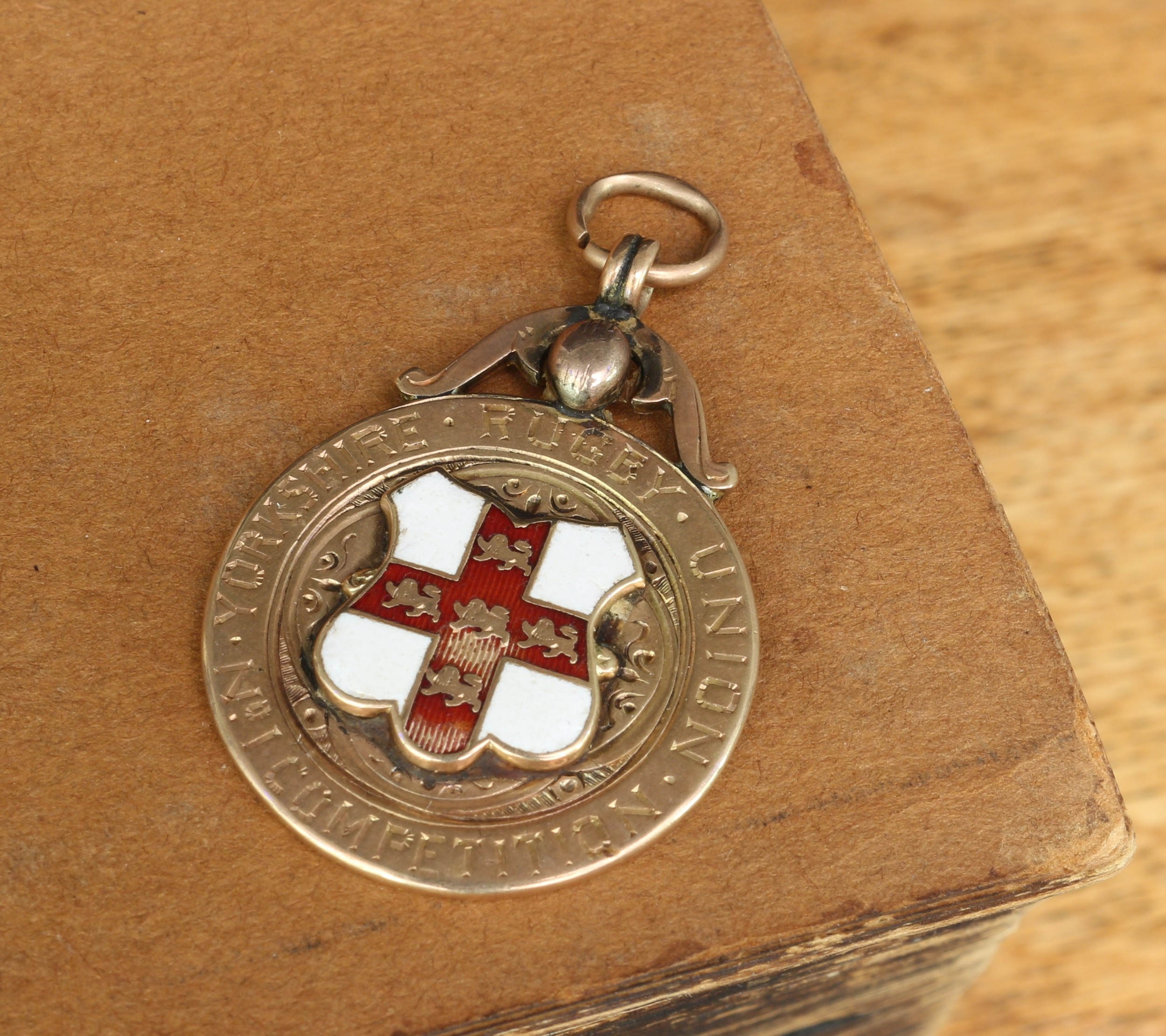 Sport, Rugby - a late Victorian 9ct gold and enamel fob medal, inscribed to the front 'YORKSHIRE RUGBY UNION NO1 COMPETITION', inscribed to the reverse '1897-98, FEATHERSTONE F.C., J.COOKSON.', Fattorini & Son, Birmingham 1897, 15.3g gross