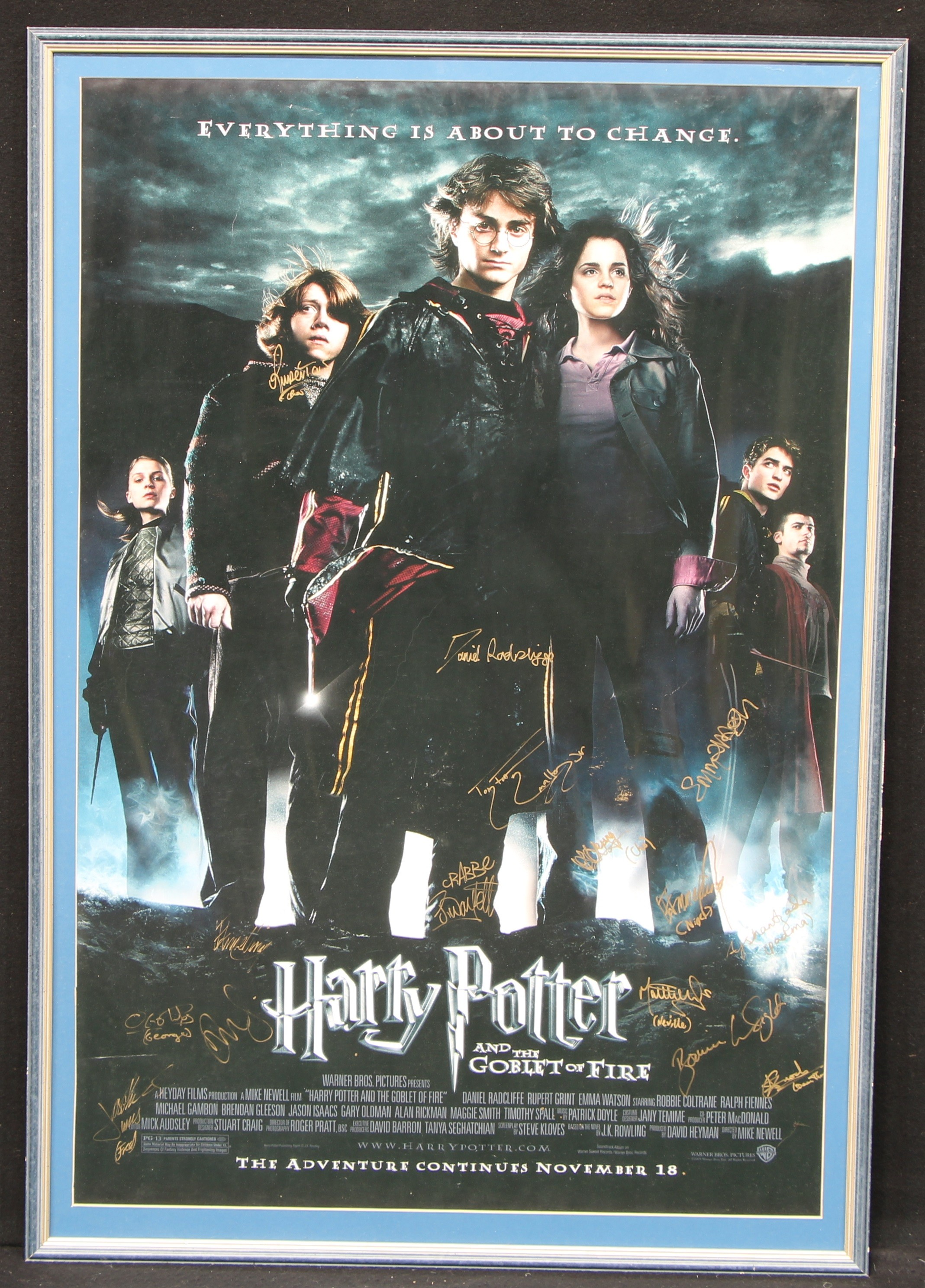 Autographs, Harry Potter - a Warner Brothers Pictures Harry Potter and the Goblet of Fire rectangular shaped promotional advertising poster, signed in gold by cast members including Daniel RADCLIFFE, Rupert GRINT, Emma WATSON, Tom FELTON, Jamie WAYLETT, Katie LEUNG, Matthew LEWIS, James PHELPS, Oliver PHELPS, William MELLING, Dean THOMAS etc, framed, 106cm high, 71cm wide (measurements excluding frame)