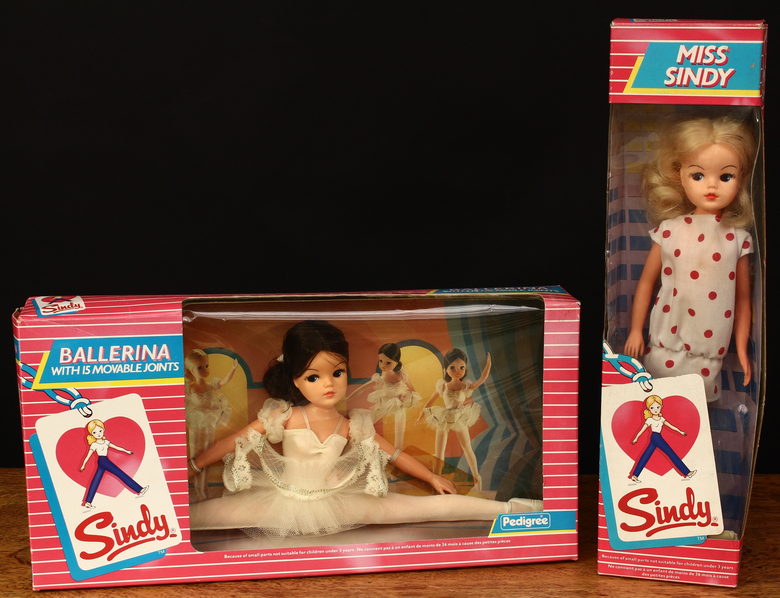 A Pedigree 42015 Sindy Ballerina doll with movable joints, brunette hair, side glancing blue eyes, the doll is attached to inner cardboard display piece, window boxed; a Pedigree 42008 Miss Sindy doll, blonde hair, side glancing blue eyes, window boxed (2)