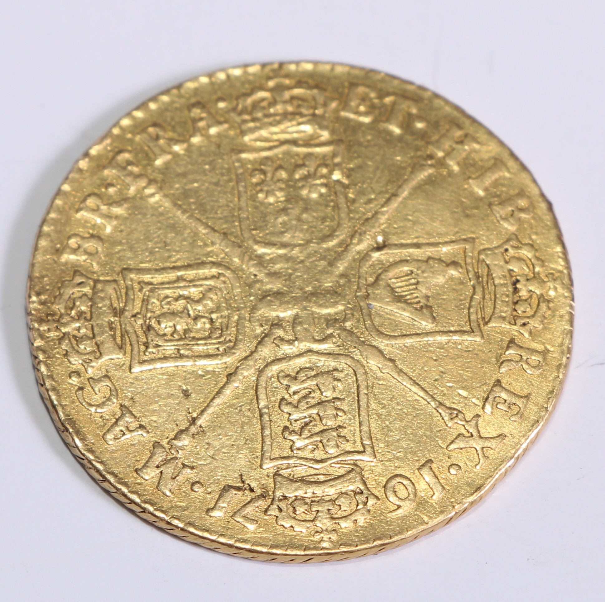A Charles II gold guinea, 1671, 8.1g