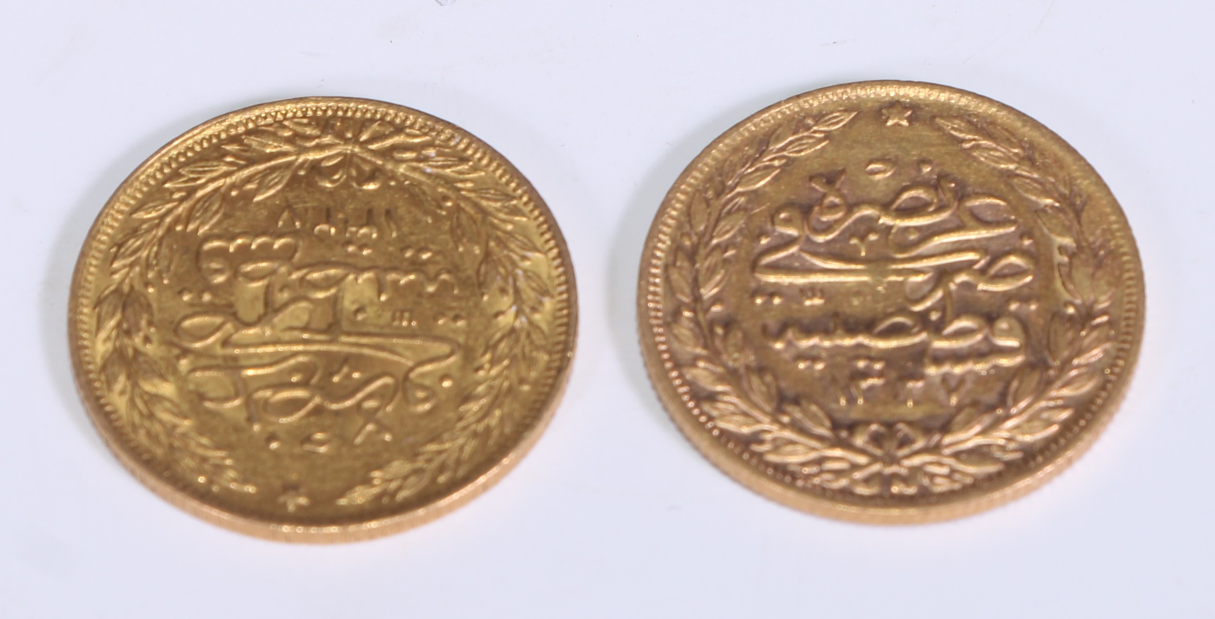 A Turkish gold one hundred Kurush coin, 7.1g; another (2)