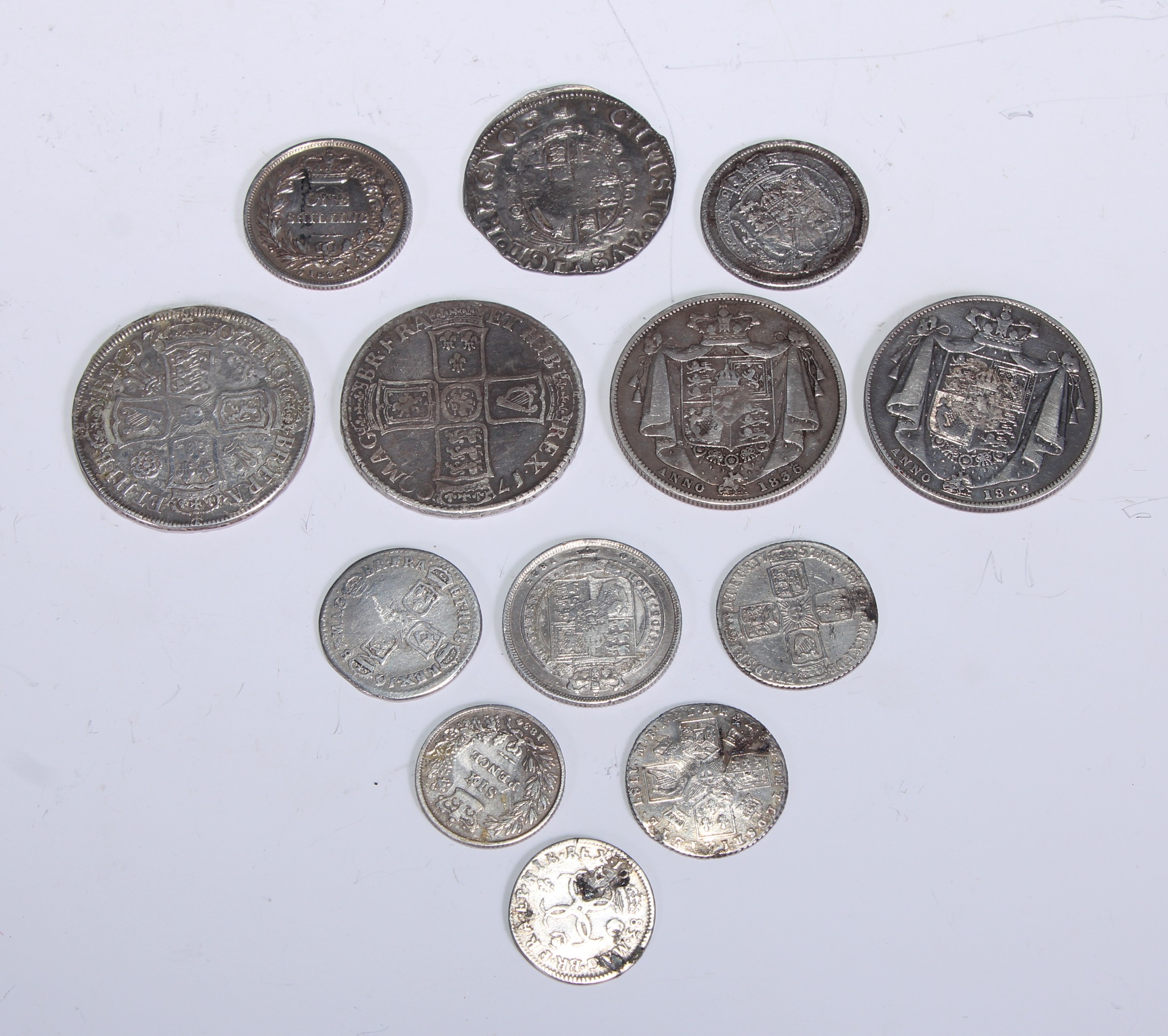 Coins - A Charles I shilling, tower mint, type 3a; a Charles II four pence, 1683; a William III half crown, 1700, first DR bust, edge DVODCIMO; A Queen Anne half crown, pre union, roses and plumes, 1707; a James II six pence, 1687, later shields; A quantity of George III, George IV and William IV silver coinage (qty)