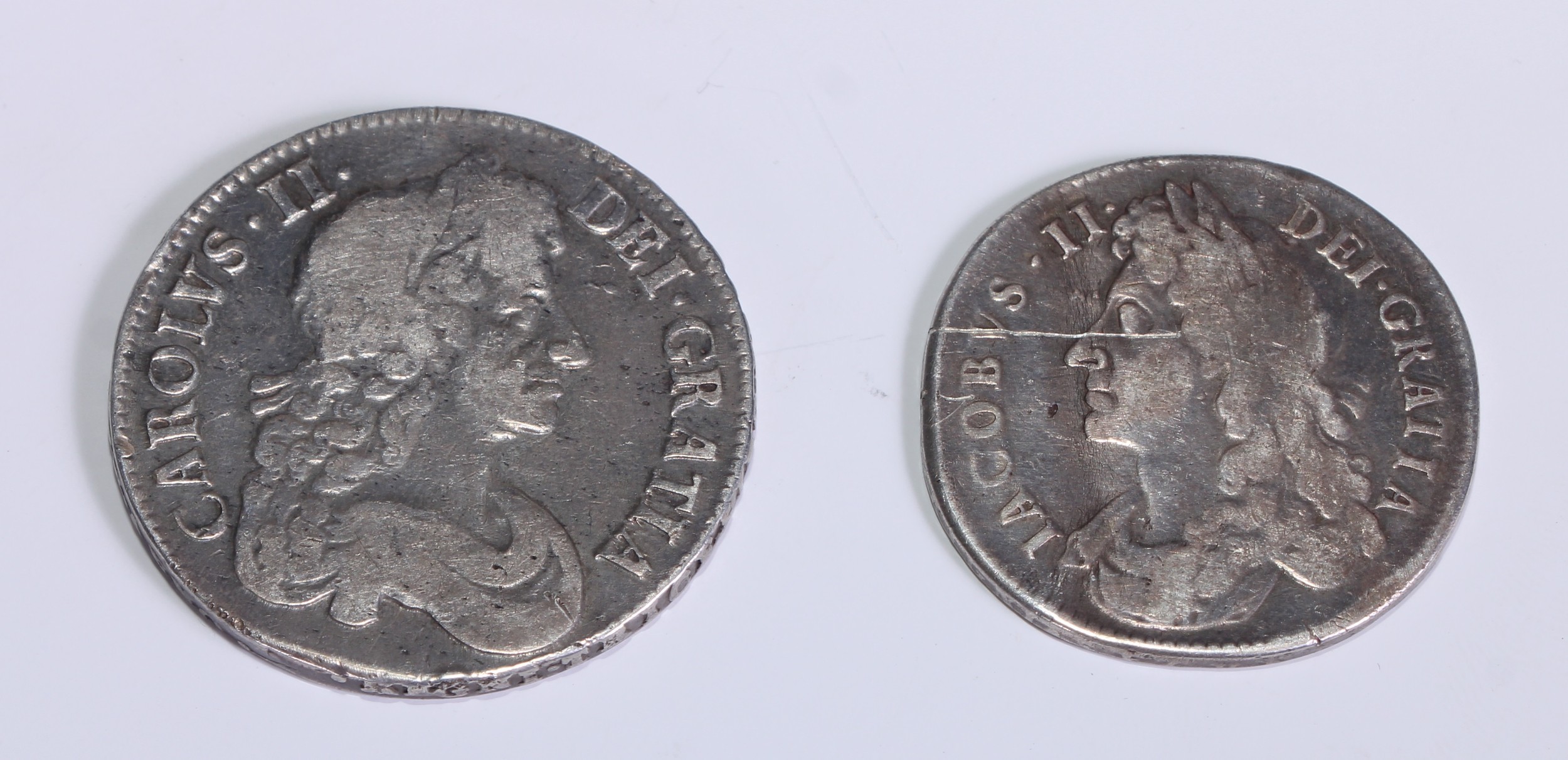 Coins - A Charles II half crown, 1679, forth DR bust; a James II half crown, 1686, first bust, edge inscription (2)