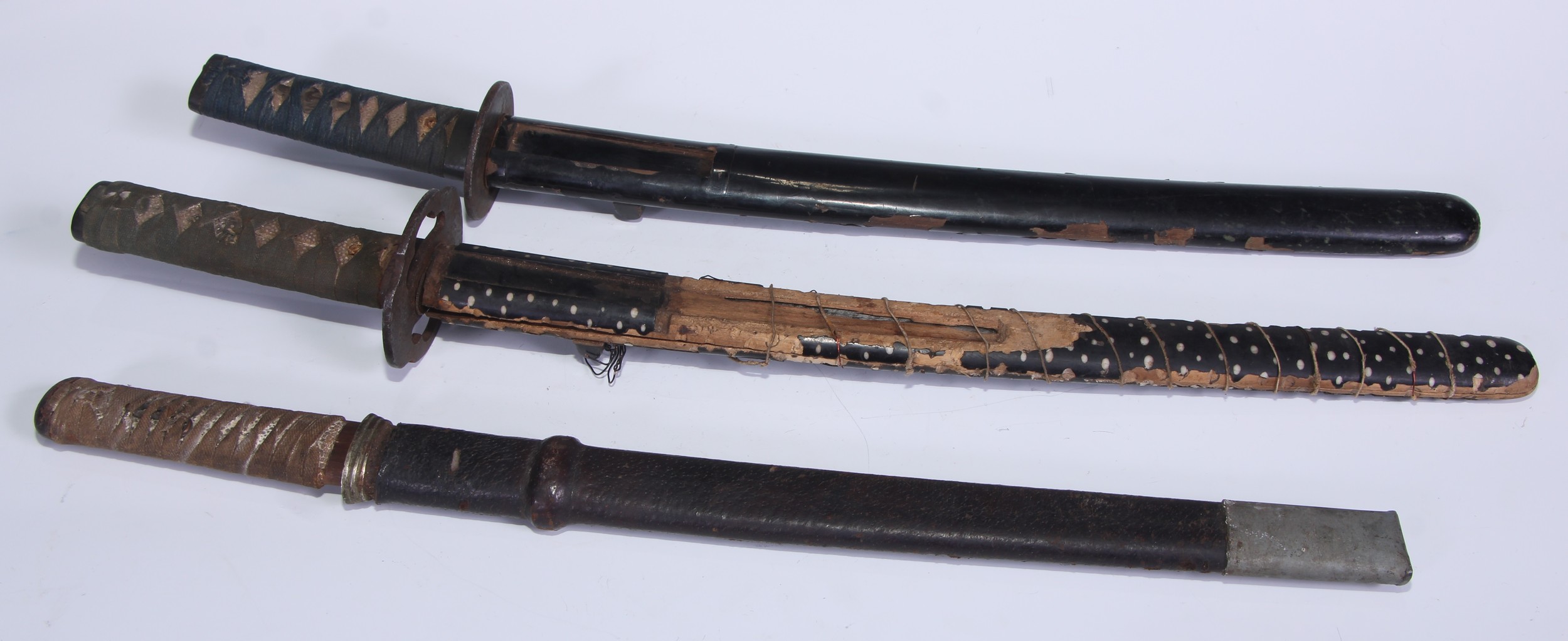 A Japanese wakizashi, 30cm curved blade, iron tsuba, cord-bound tsuka, lacquer saya, 54cm long overall; others, similar (3)