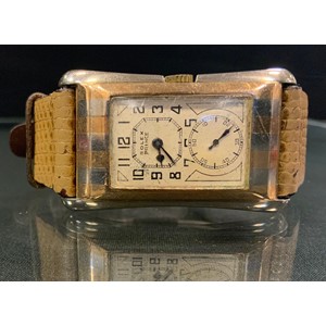 Rolex - a Gentleman's Rolex Prince Brancard wristwatch, rectangular dial signed Rolex Prince, higher dial with Arabic numerals, blued steel hands, lower dial indicates seconds, rectangular flared case 43mm by 26mm with curved profile and alternate white and yellow "Zebra" stripes, snap on case back internally marked Rolex 25 World's Records, Geneva-Suisse  'R.W.C.Ltd' 9ct gold case, import marks Glasgow 1929, manual wind movement signed 'Rolex Hairspring Timed 6 Positions Observatory Quality 15 Rubies' and signed 'Rolex Extra Prima' to the barrel, movement serial number 71889, model number 971A, serial number 68283, fitted with a later snakeskin effect strap, 32.4g gross