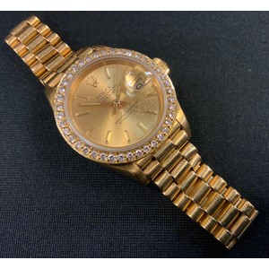 A ladies Rolex Datejust Oyster Perpetual Superlative Chronometer 18ct gold bracelet wristwatch, signed gilt dial, date aperture, diamond encrusted bezel, integral bracelet, 8570F, 750 18k import marks, 71.8g gross
