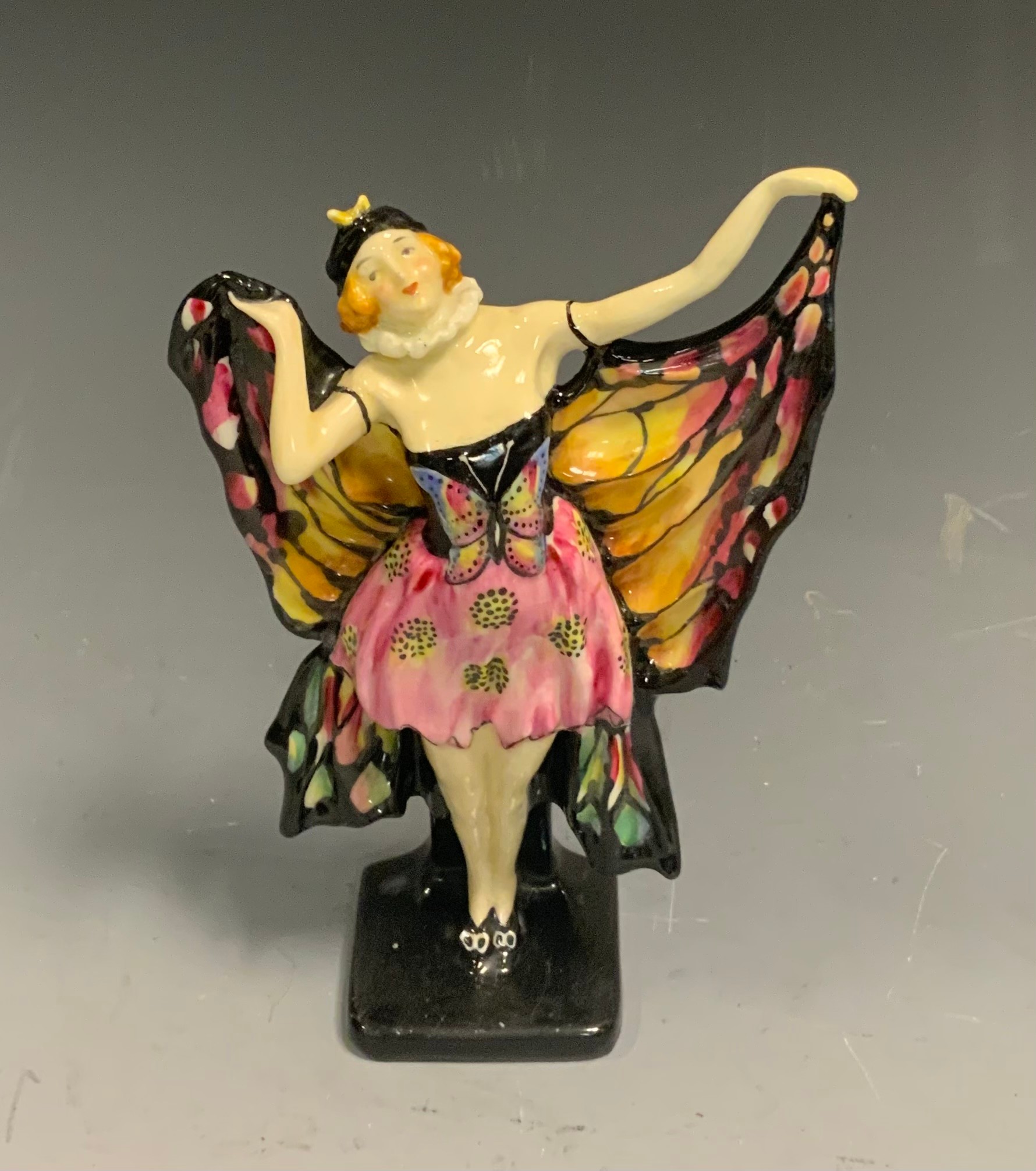 A Royal Doulton model,  Butterfly  HN 719, designed by Arthur Leslie Harradine, introduced 1925, withdrawn by 1938, green printed factory mark, black text