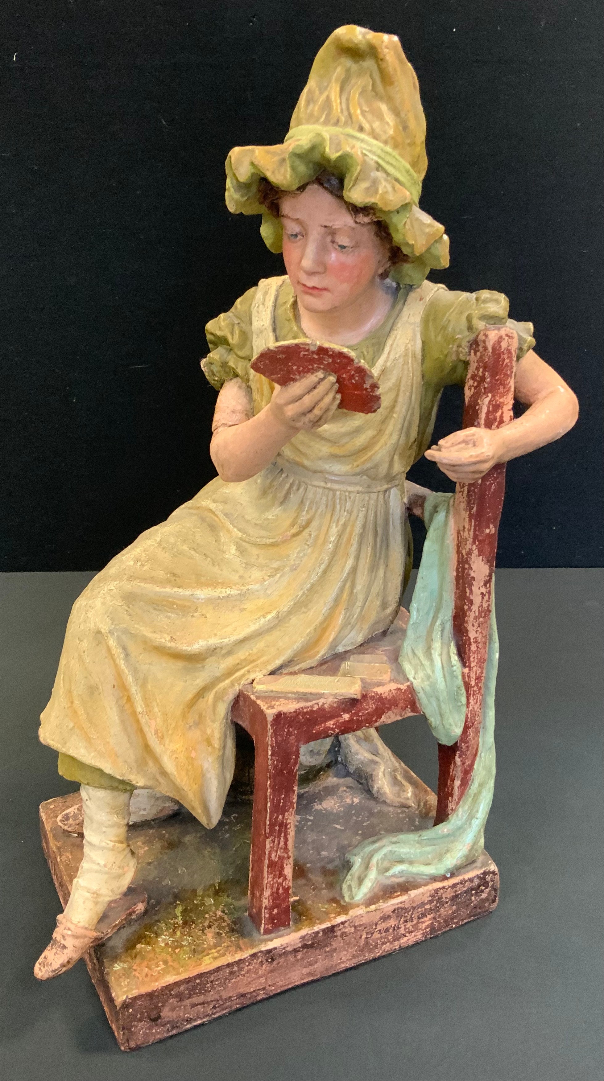 A Doulton Lambeth figure, modelled by  Fred Catticott,  The Marchioness, playing cards, after, Dick Swiveller and the Marchioness playing cards, from The Old Curiosity Shop, Charles Dickens, 44cm high, impressed mark, incised 1887