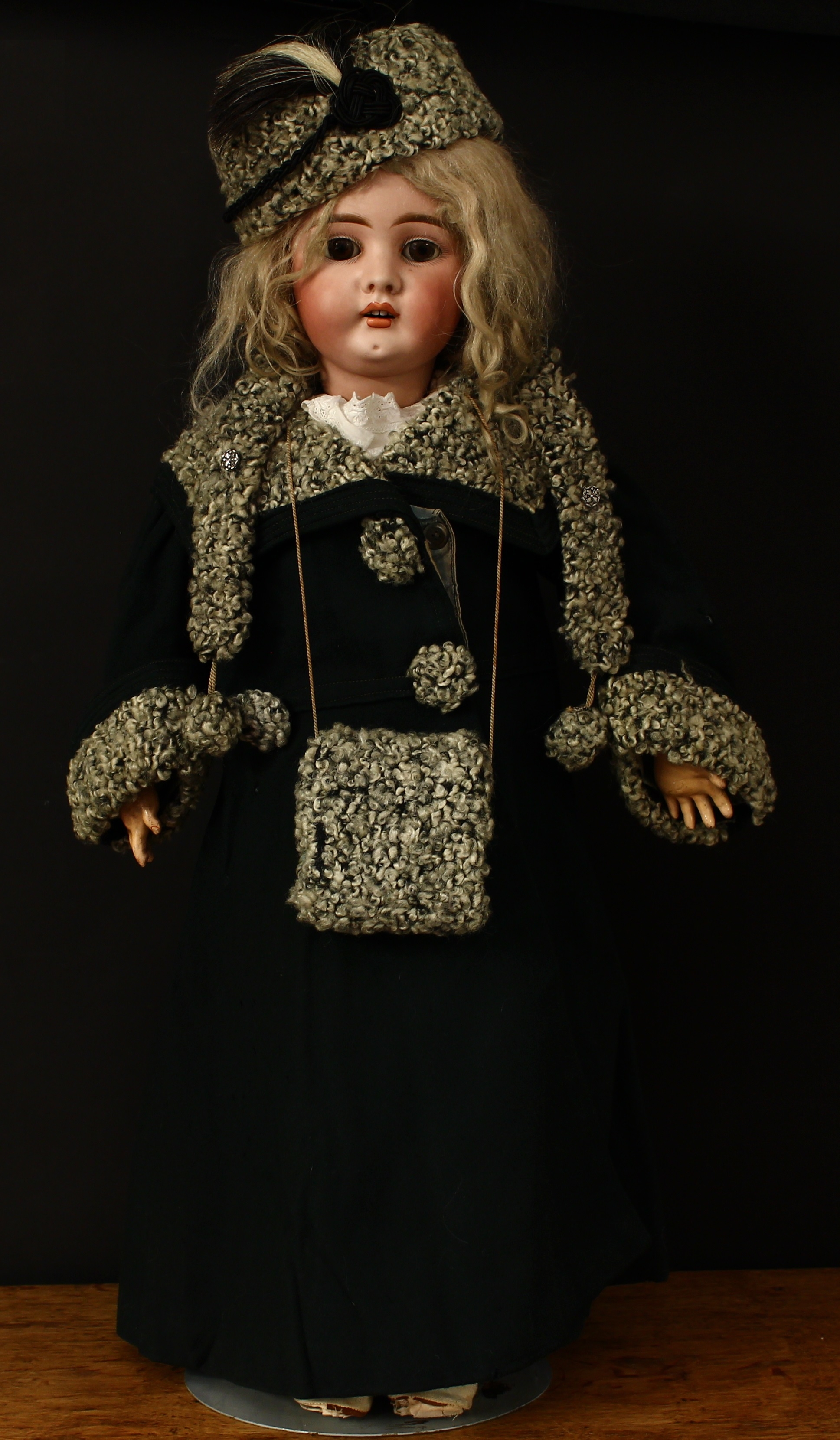 A Bahr & Pröschild (Germany) bisque head and ball jointed composition bodied doll, weighted sleeping brown glass eyes, painted features including fine eyelashes and brown feathered eyebrows, open mouth revealing upper teeth, blonde wig on a pate, impressed marks '394 14', cm high, packaged in a bespoke case with various correspondence and invoices from the 1960's between a previous owner of the doll and Guillame 59 Davies Street, Berkeley Square, London, W.1 Mayfair 2275, regarding the cleaning of the dolls clothes