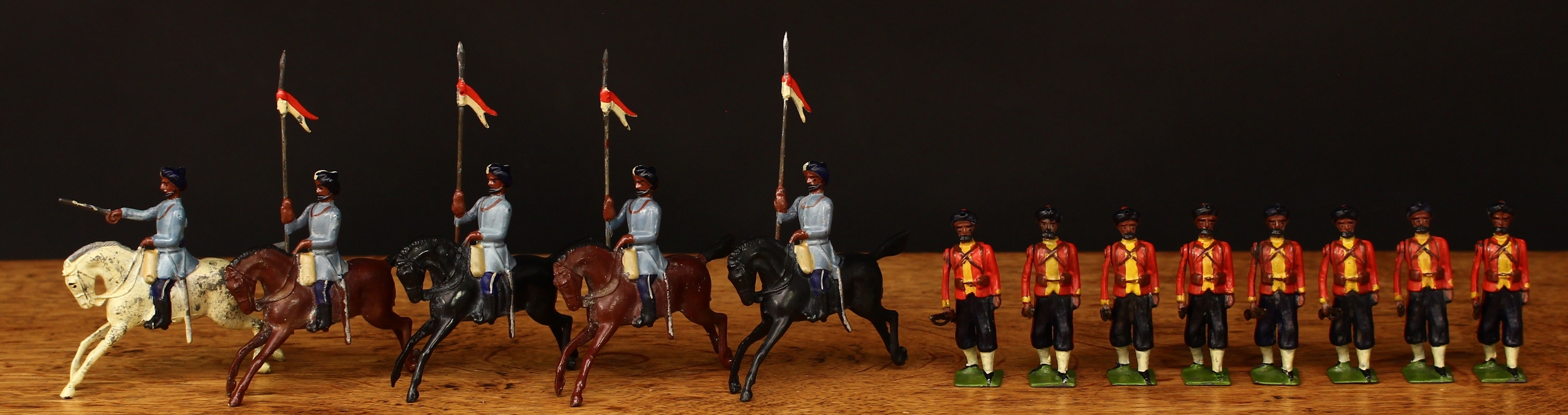 W Britain (Britains) Indian Army display set No.64, comprising eight 7th Bengal Infantry each marching at the trail, Slade Wallace versions with square bases, four 2nd Madras Lancers mounted cavalry figures and an Officer with sabre, each unboxed (13)