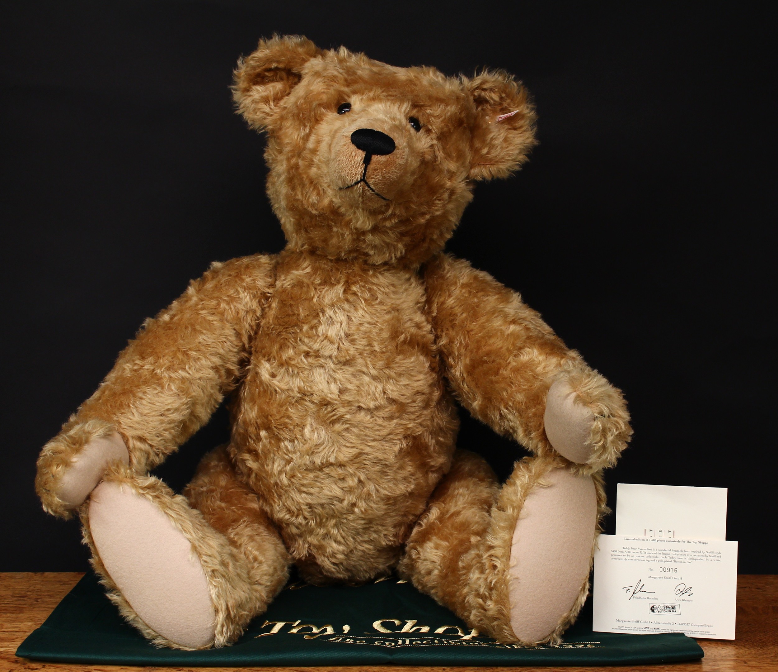 Steiff (Germany) EAN 667244 Maximilian teddy bear, exclusive to The Toy Shoppe of Richmond, VA, trademark Steiff button to ear with red and white tag, 80cm high, presented in drawstring bag with certificate, Limited Edition No.00916 of 1,500