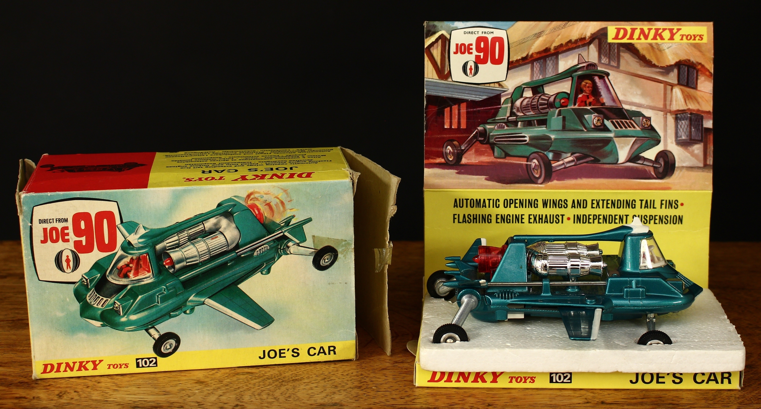 Dinky Toys 102 Joe's car from the Gerry Anderson T.V. series Joe 90, metallic green body with white interior, seated plastic driver figure, opening wings and extending tail fins, red plastic engine thruster, boxed with original inner pictorial display stand and original inner polystyrene packaging piece
