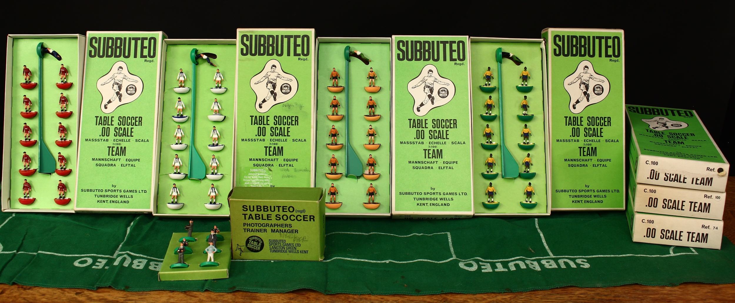 Subbuteo 1:100 scale table soccer football teams and accessories, comprising Ref.3 Huddersfield, boxed with original inner cardboard display piece; Ref.50 Brazil, boxed with original inner cardboard display piece; Ref.74 Aston Villa, second version with white shorts, boxed with original inner cardboard display piece; Ref.77 Wolverhampton Wanderers, boxed with original inner cardboard display piece; Ref.100 Manchester United, boxed with original inner cardboard display piece; Ref.153 blank team with painted detail, boxed with original inner cardboard display piece; other teams, accessories and literature including C.134 six ball boys, boxed and C.119 Jules Rimet World Cup trophy, boxed etc (quantity)