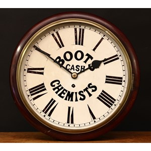 A Victorian mahogany circular wall clock, 'BOOTS CASH CHEMISTS'