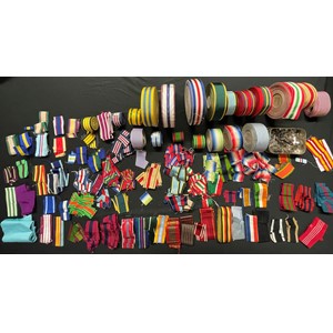 British Medal Ribbons. Original, new old stock ribbons. A large quantity of ribbons all original no modern reproductions. Ribbons date from pre WW1 through WW2 and up to the 1990's. Some of the WW2 ribbons on reels are dated 1945. Also some foreign ribbons such as Russian St Anne, French Croix de Guerre, US Bronze Star. Plus a tin full of ribbon emblems, MiD Oakleaves, Rosesettes etc.