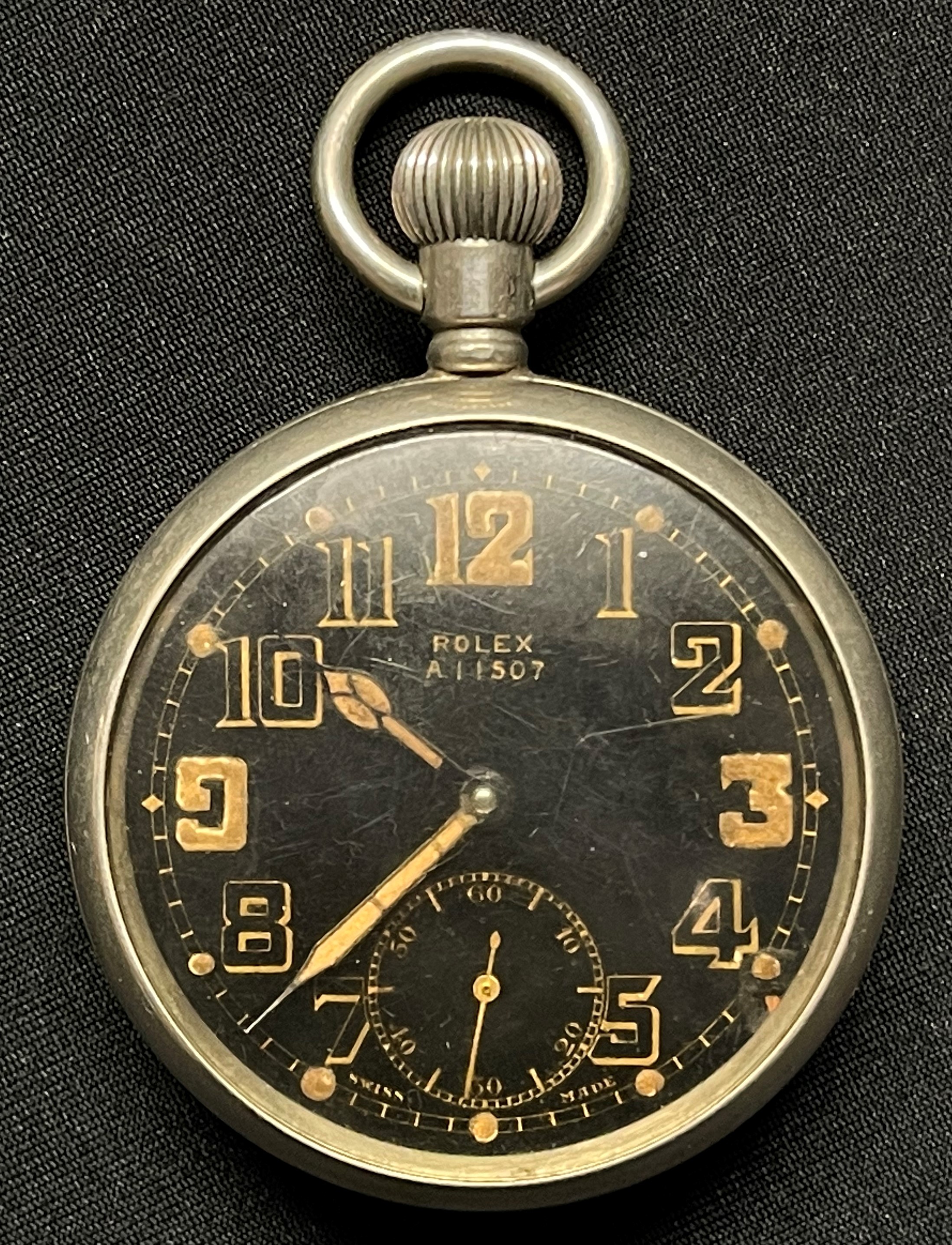 WW2 British Rolex pocket watch. Black dial with Arabic numerals, separate seconds dial. Marked Rolex A11507 to dial and back inscribed A 11507, G.S. Mk II plus WD Broad Arrow. Side of case also marked with number. Movement marked "Rolex 15 Rubies Swiss Made". Runs and ticks, would recommend a service.