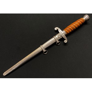 WW2 Third Reich Heer Offizierdolch Army Officers Dagger with double edged blade 250mm in length maker marked "Original Eickhorn, Solingen". Early heavy plated fittings. Orange grip. Overall length 375mm. Complete with original scabbard again with early plated fittings.