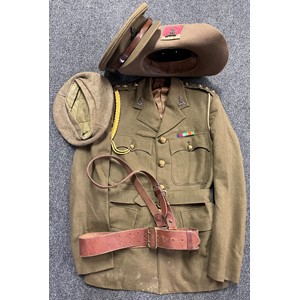 WW2 British Pioneer Corps officer's service dress jacket complete with all buttons and insignia, a brown leather Sam brown belt by Hector Rowe belt, a Hector Powe Service Dress Officers cap with Pioneer Corps Bronze cap badge; black leather slip on ankle boots;  OR's GS Cap 1945 dated: Slouch hat with Plastic Pioneer Corps cap badge. Named to  RP Knighton. New to the market.