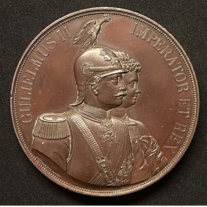 Imperial German Bronze Medallion featuring Kaiser Wilhelm II and the Empress. Struck to commemorate a visit to the City of London by the German Emperor William II and Empress Augusta Victoria, July 10, 1891. Heavy bronze medallion 80mm in diameter, 8mm thick and weight 330 grams. Maker marked "Elkington & Co, London."