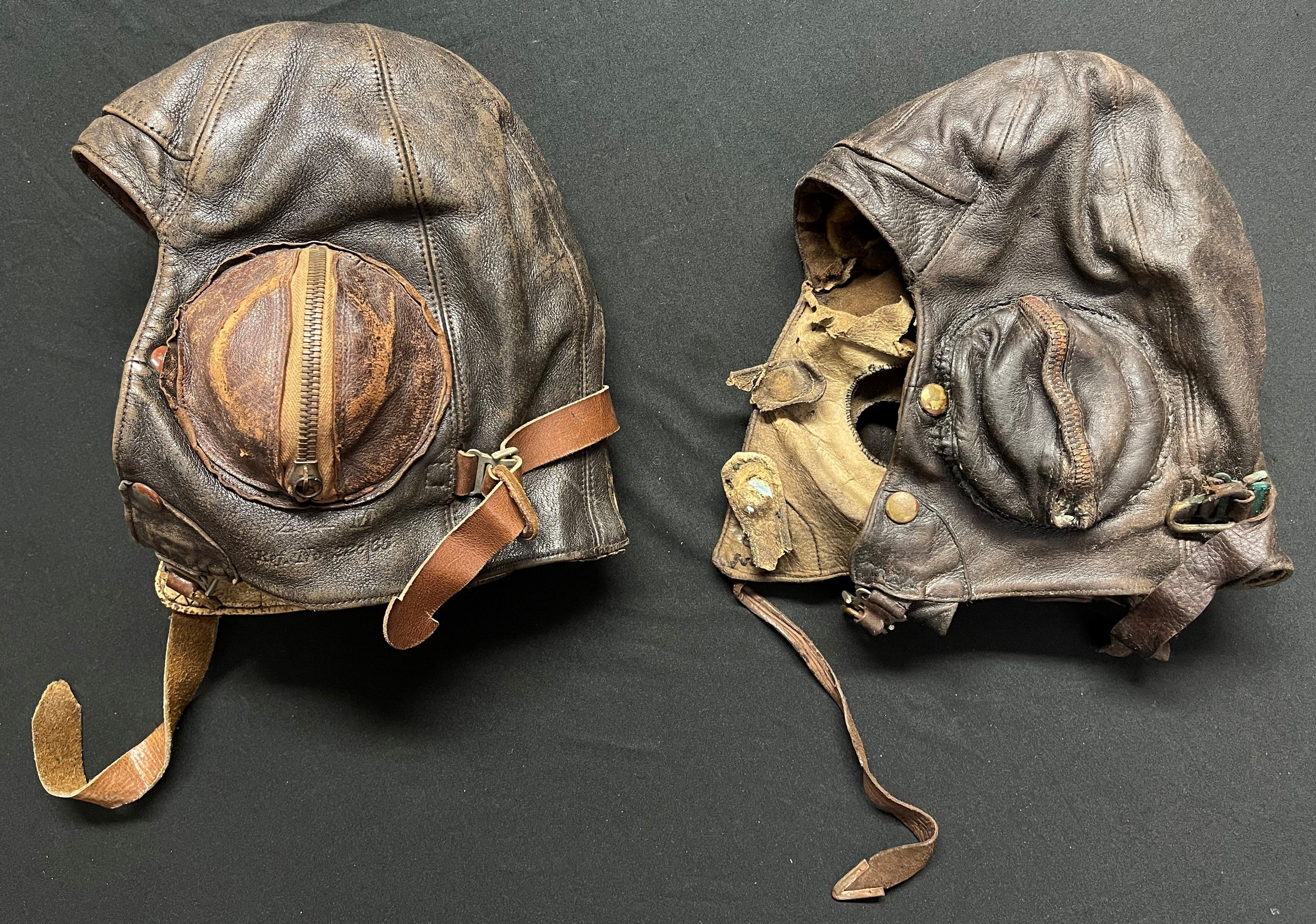 WW2 British RAF B Type Leather Flying Helmets: One in good condition size 6 1/2 to 6 3/4 maker marked and dated "B Starling & Co Ltd 1939".  Plus another in relic condition suitable for restoration. (2)