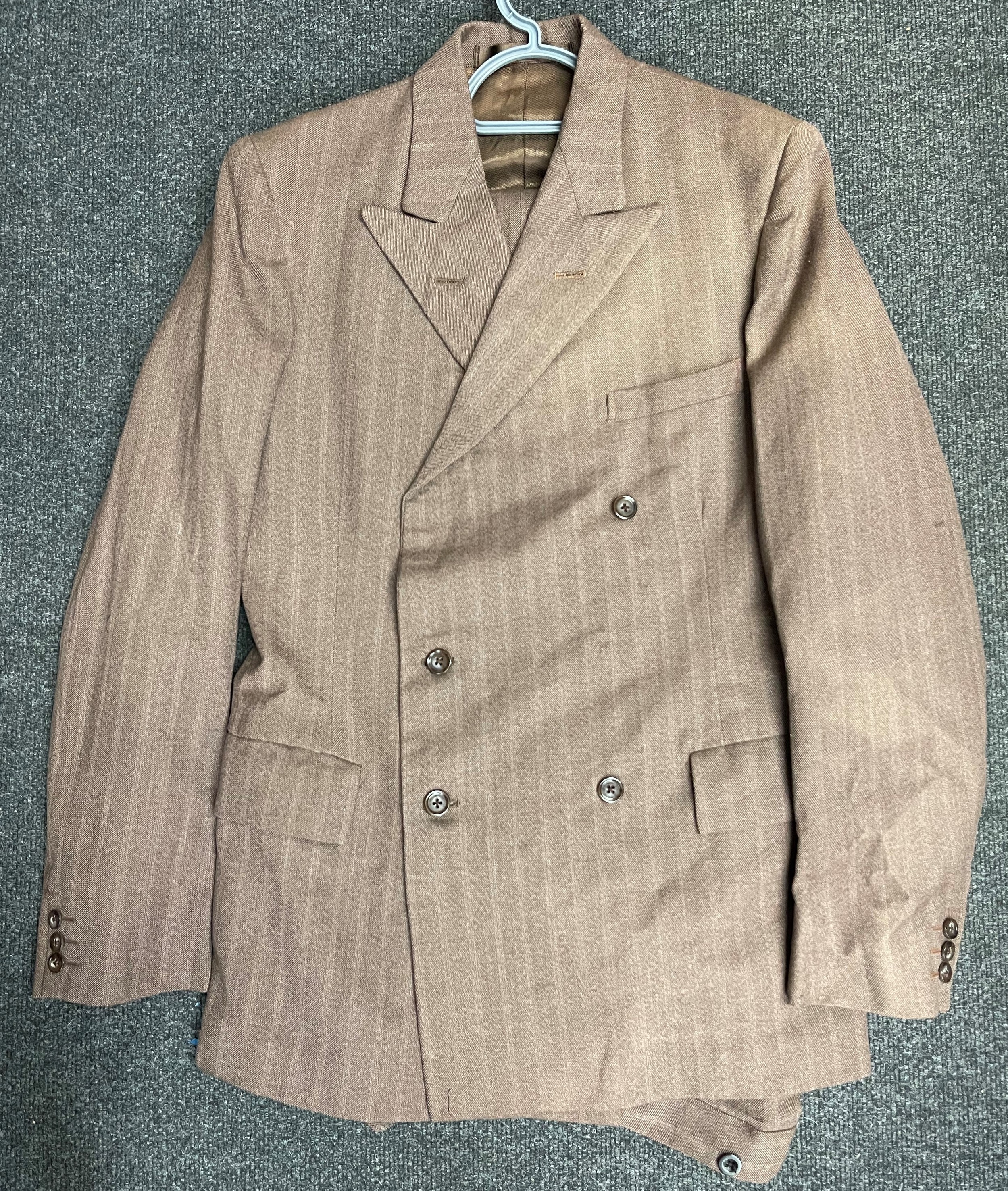 Post War British Serviceman's Demob Suit Double Breasted Jacket in brown, unissued condition  Size 36 Long. Complete with label dated 1957. Plus matching trousers approx. 30 inch waist. No label.