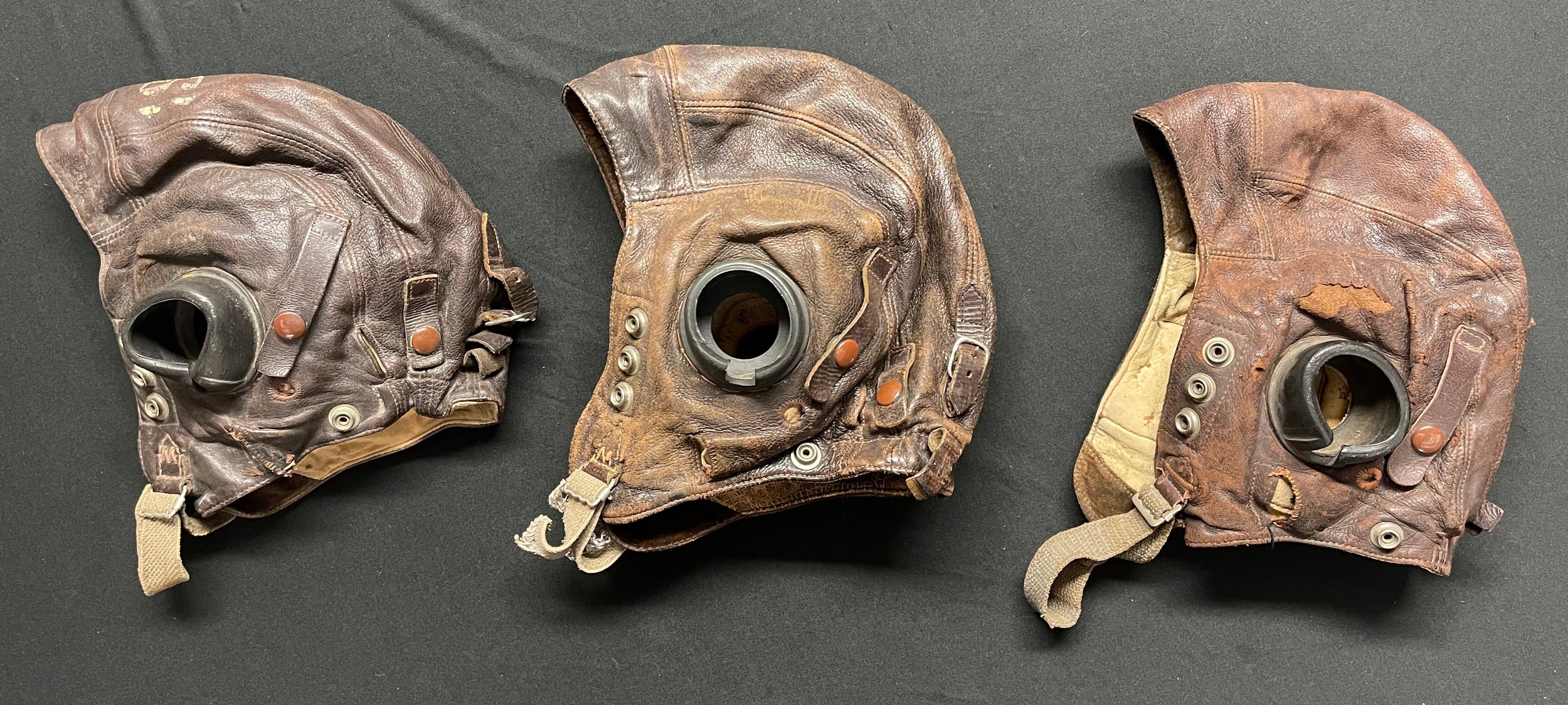 WW2 British RAF C Type Leather Flying Helmets x 3. One has a white painted number 19 on the crown. (3)