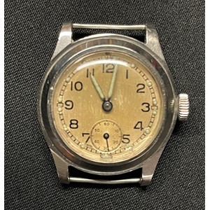 WW2 British ATP Army Trade Pattern Wristwatch with enamel dial with Arabic Numerals and separate seconds dial. Luminous hands and dial markings. Marked "Swiss Made". No strap. Reverse of case marked with WD Broad Arrow along with ATP and serial number 53669. Movement marked "Enicar" and "17 Jewels". Runs and ticks would recommend a service.