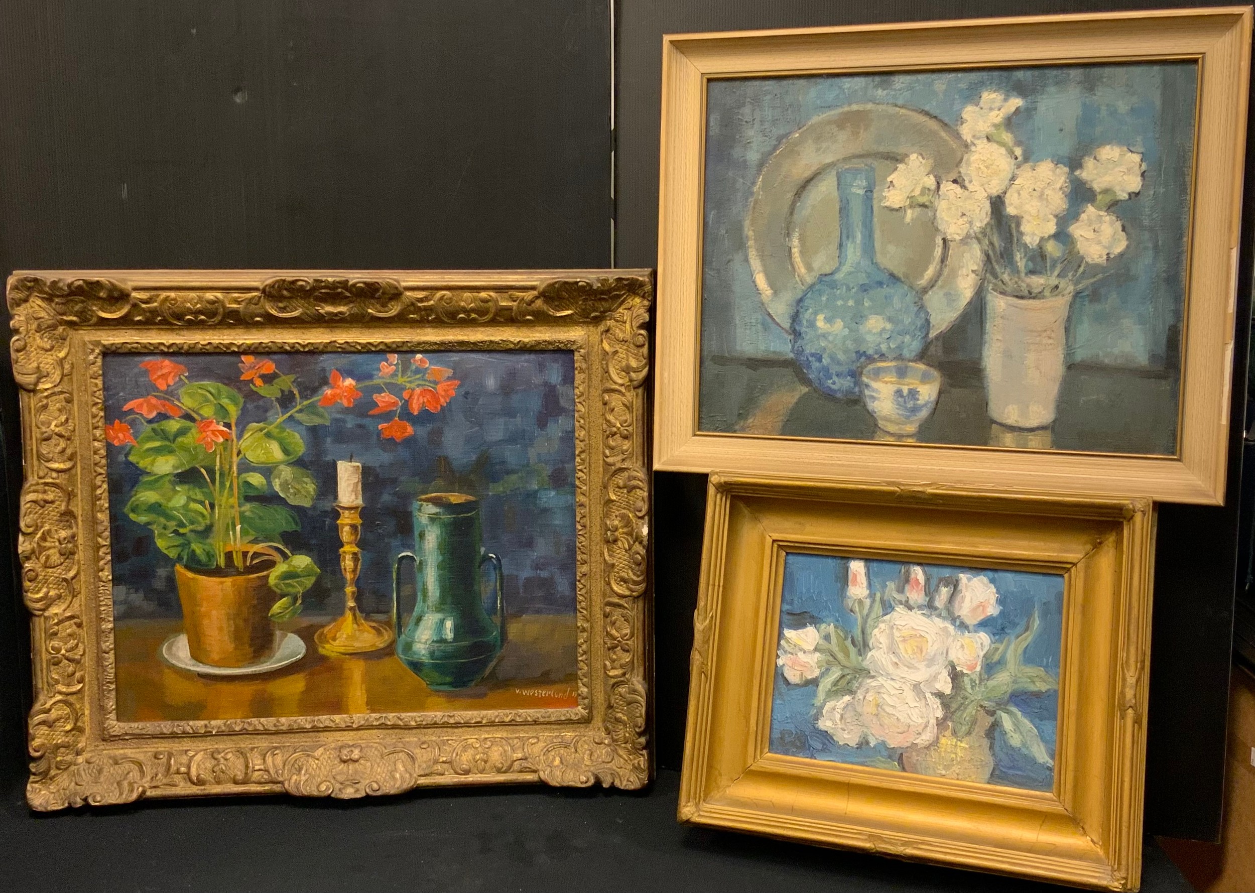 Viktor Westerlund, Still life - Geraniums, Candlestick, and a twin-handled vase, signed, oil on board, 38cm x 47.5cm;  another two, 'vase and flowers in blue and white', and study of roses, (3).
