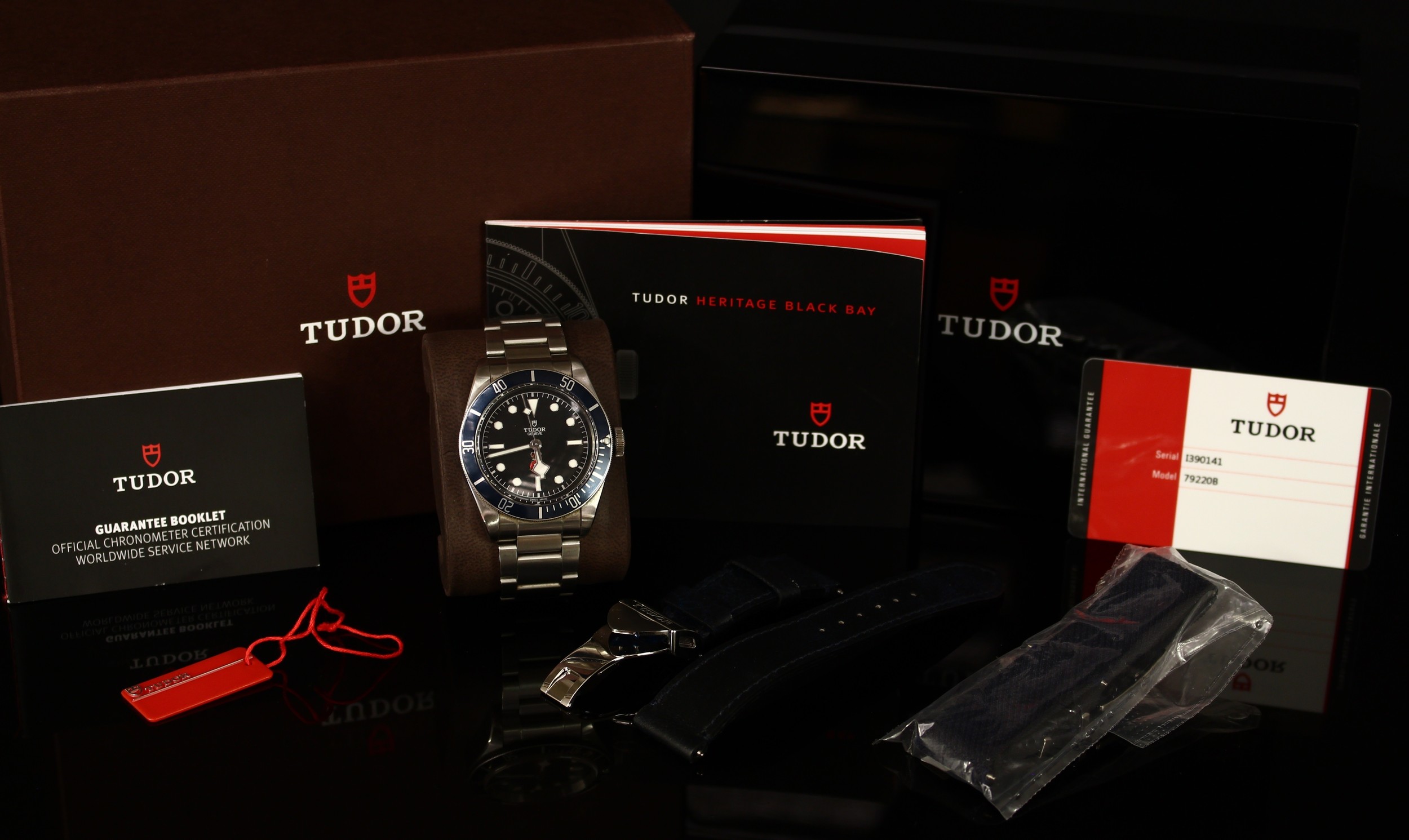 A Tudor Black Bay 'Royalty and Specialist Protection', model 79220B, stainless steel wristwatch, the black dial with the insignia of the RaSP Unit (the shield that protects the crown), 2824 automatic, 25 jewels, stainless steel screw-down back inscribed P201776, ROYALTY & SPECIALIST PROTECTION, number 61 out of 75 made, Tudor stainless steel strap, additional Tudor stainless steel and black leather strap, Tudor warranty card, original invoice and receipt, instruction manual, guarantee booklet and card, original case, box and slip cover, c.2018.  The Black Bay watch was created at the special request of the Metropolitan Police's Royalty and Specialist Protection Unit (RaSP).  The RaSP Unit is a formation of armed police officers responsible for the protection of the Royal Family, foreign diplomats, members of parliament including the Prime Minister.  This watch comes from the family of an actively serving member of the RaSP Unit. This is a rare opportunity to acquire an important watch. The only other example known to have been sold was handled through Sothebys, London.