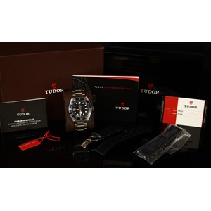 A Tudor Black Bay 'Royalty and Specialist Protection', model 79220B, stainless steel wristwatch, the black dial with the insignia of the RaSP Unit (the shield that protects the crown), 2824 automatic, 25 jewels, stainless steel screw-down back inscribed P201776, ROYALTY & SPECIALIST PROTECTION, number 61 out of 75 made, Tudor stainless steel strap, additional Tudor stainless steel and black leather strap, Tudor warranty card, original invoice and receipt, instruction manual, guarantee booklet and card, original case, box and slip cover, c.2018.  The Black Bay watch was created at the special request of the Metropolitan Police's Royalty and Specialist Protection Unit (RaSP).  The RaSP Unit is a formation of armed police officers responsible for the protection of the Royal Family, foreign diplomats, members of parliament including the Prime Minister.  This watch comes from the family of an actively serving member of the RaSP Unit. This is a rare opportunity to acquire an important watch. The only other example known to have been sold was handled through Sothebys, London.