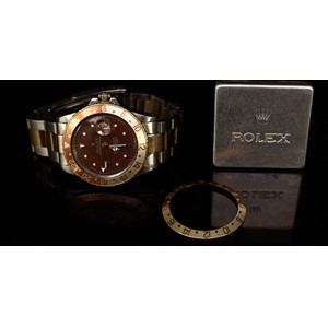 A Rolex Oyster Perpetual GMT-Master Superlative Chronometer, brown dial, baton indicators, date aperture, centre seconds hand, with spare bezel in a Rolex tin