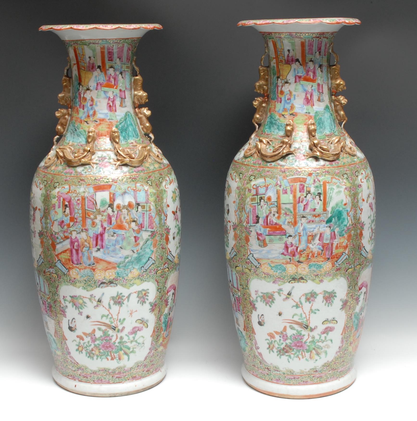 A pair of large Chinese famille rose ovoid vases, painted in the Cantonese manner with figures of the court, birds, butterflies, flowers, and scrolls, wavy rims, 61cm high, Canton, c. 1860