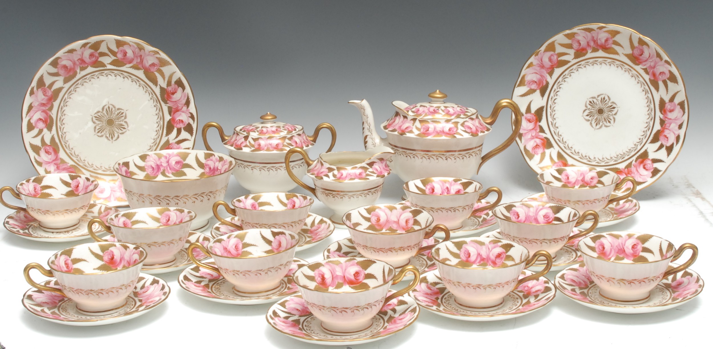 A Spode tea service , for twelve, comprising teapot, sucrier and cover, milk jug, slop bowl, two plates, cups and saucers, decorated with roses and gilt foliage, pattern 4474