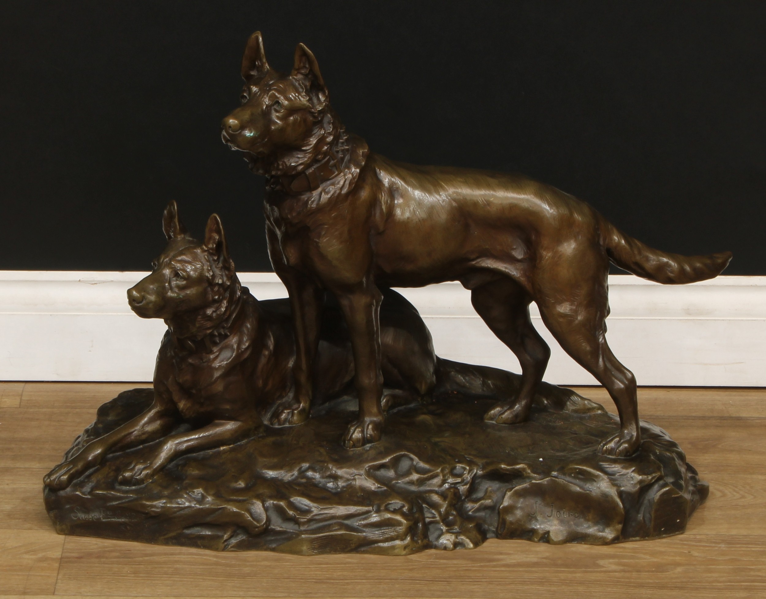 Jean Joire,  French,  1862-1950 a patinated bronze,  Two alsatians,  signed: J. Joire, inscribed with Susse Fres Edts Paris with a dedication plaque inscribed 'A JACQUES GUILLAUMET Ses Amis & Collaborateurs EN RECONNAISSANCE DE SON DƒVOUENMENT POUR TOUS 18th OCTOBRE 1924, 49cm high, 70cm wide