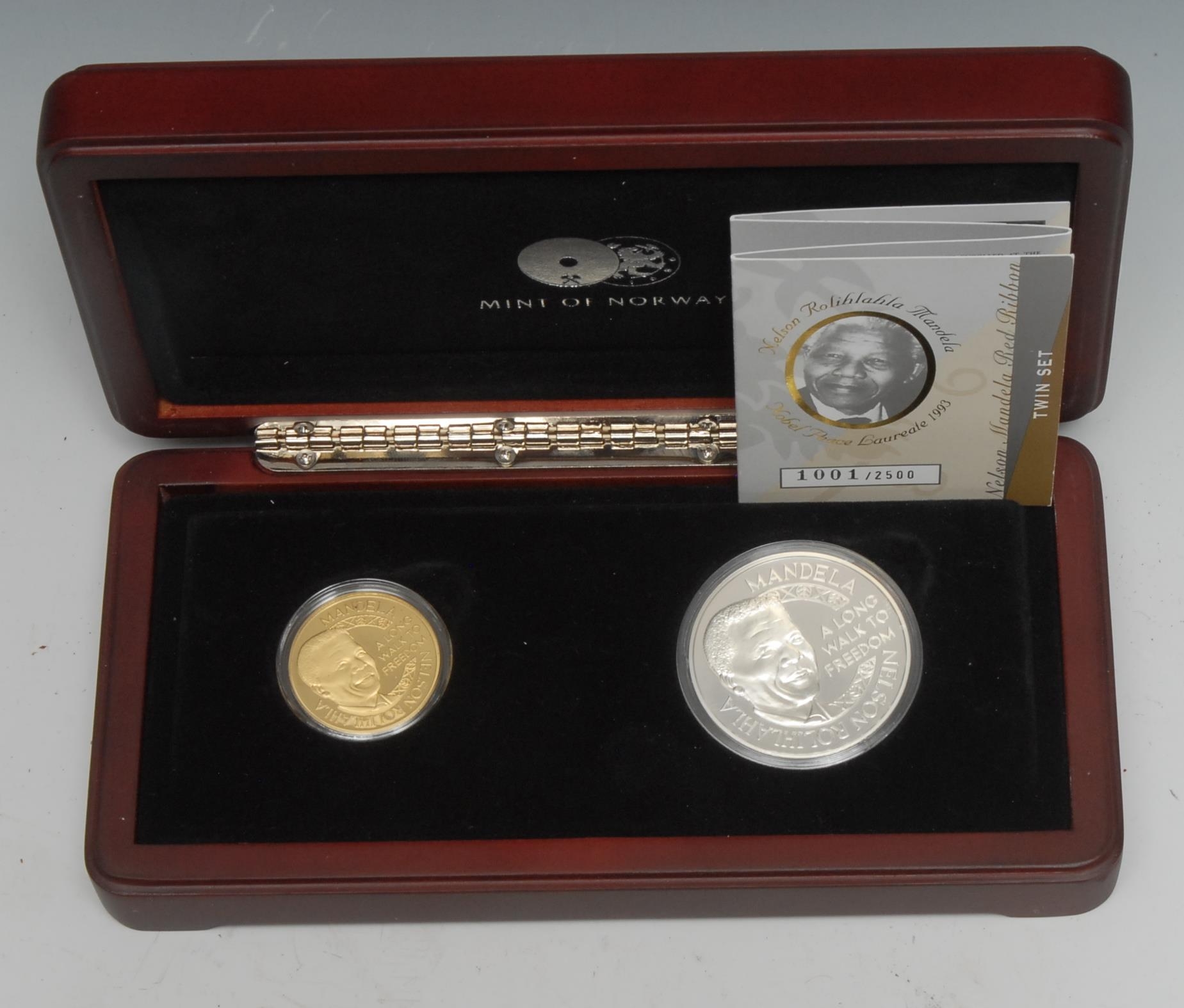 Nelson Mandela - Coins and Medals - A Nelson Mandela, Mint of Norway, set of three commemorative medallions, Liliesleaf memory and legacy set, two 24ct gold, the raid, 11th July 1963, the escape, 11th August 1963, each 7.08g, a silver palace of justice the trial medallion, 28.34g, limited edition 928/2000, issued 2013, boxed.