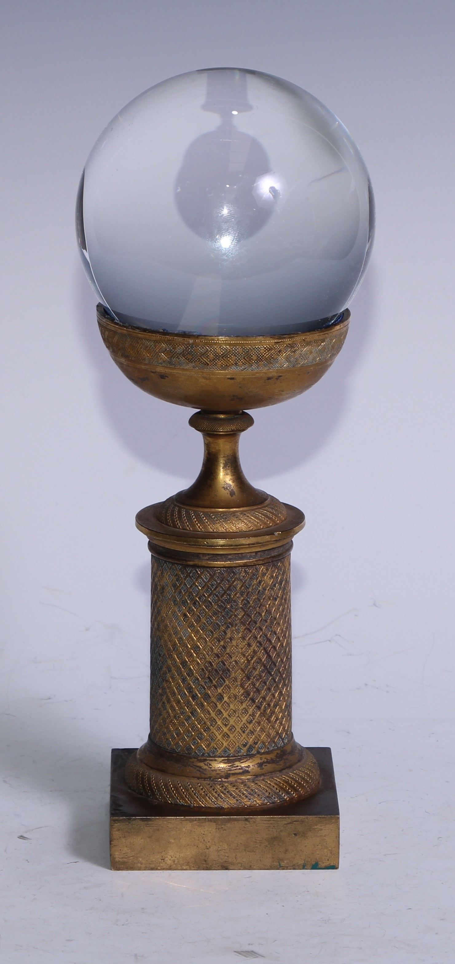 Mysticism and the Occult - a crystal ball, the gilt bronze Empire stand mid-19th century, 26cm high