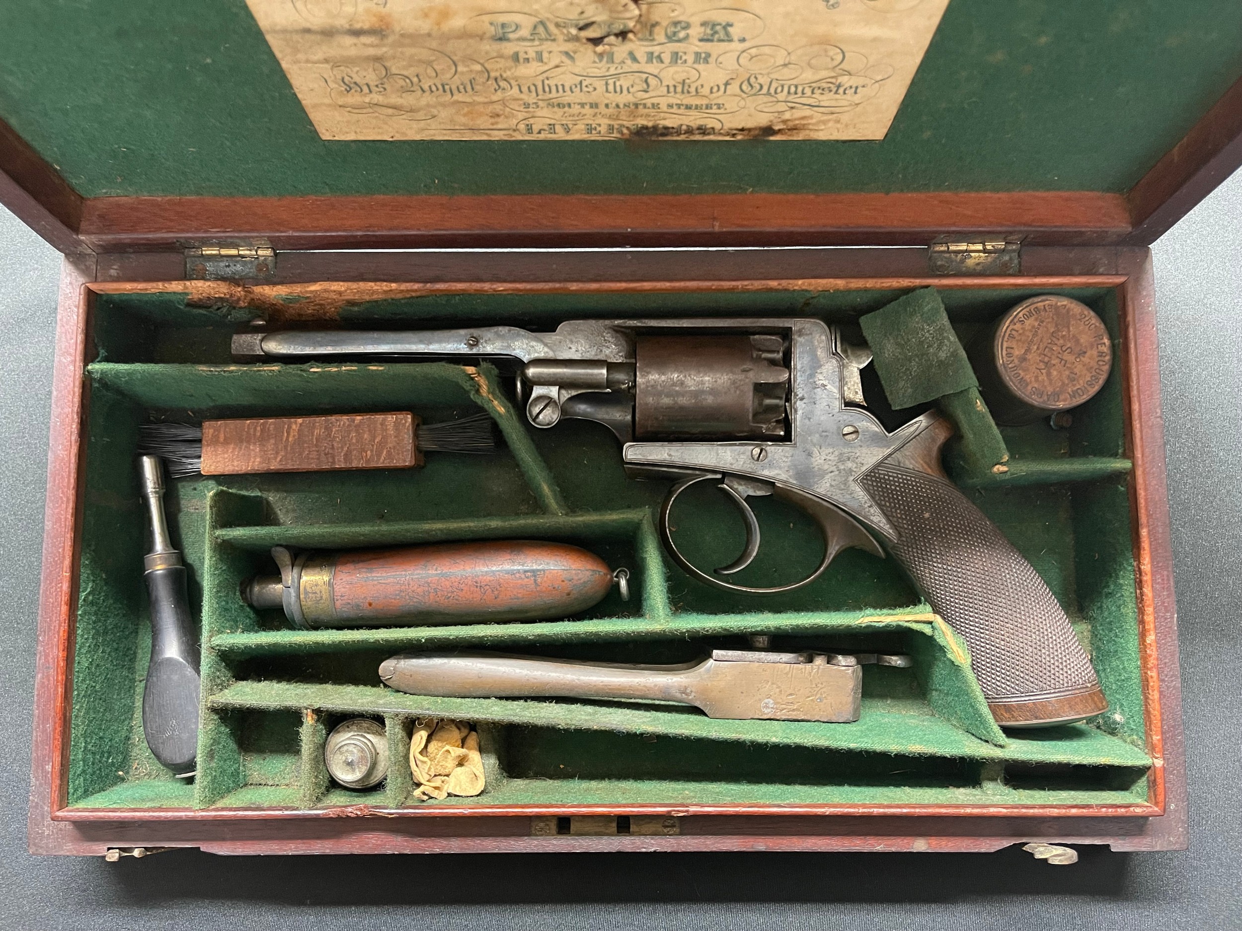 Cased Beaumont Adams Double Action 54 Bore Percussion Cap Revolver serial number B15381. Adams Patent No.31045R. 140mm long barrel. Top strap engraved "William & Powell, 25 South Castle St. Liverpool". Working order. Good original finish.  Overall length 299mm. London Proof marked. Complete is original wooden case with label, along with bullet mould, Hawksley powder flask, tin of caps, brush, oil bottle etc. Section 58 (2) no licence required.