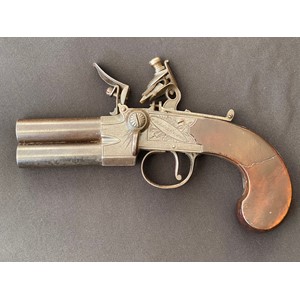 A scarce Double Barrel Over and Under Flintlock Tap Action Pistol by Wheeler & Sons London. 65mm long barrels. Engraved with makers mark and London along with piled arms. Working action which holds at both full and half cocked positions. Working safety catch. Butt is inset with a blank silver escutcheon plate. Clear English Proof marks. Overall length 185mm. Section 58 (2) no licence required.