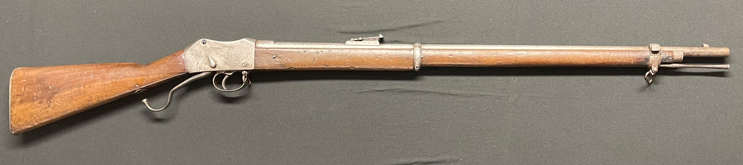 Martini Henry Rifle maker marked and dated "Enfield 1872" to lock plate. 820mm long barrel. .557/450 cal. Overall length 125.5cm. Complete with cleaning rod. Action a/f.  Section 58 (2) obsolete calibre no licence required.