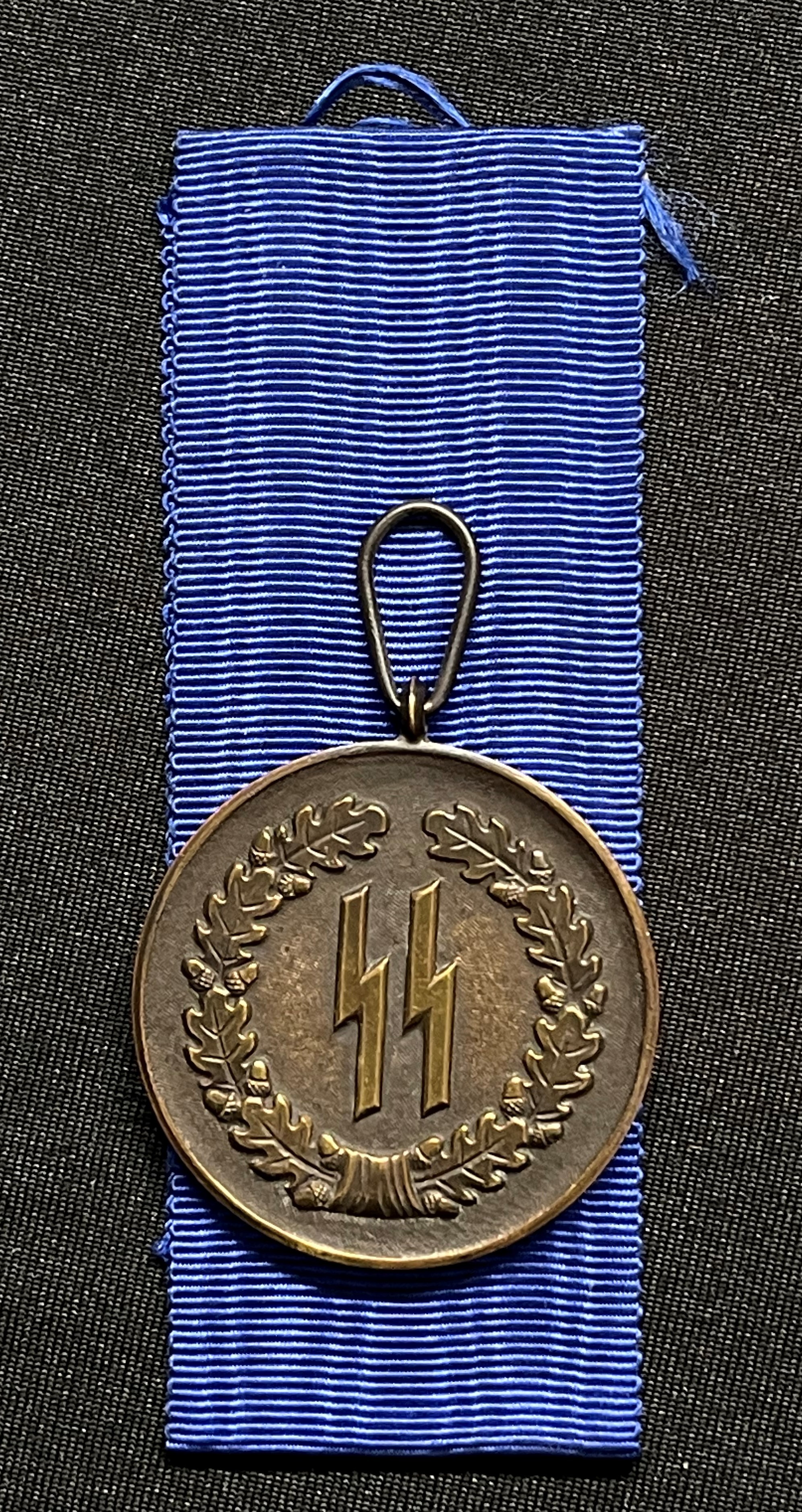 WW2 Third Reich SS-Dienstauszeichnung 4.Stufe (4 Jahre) - SS Long Service Award 4th Class (4 Years). Complete with full length original ribbon. No makers mark. War souvenir of a British Veteran, Trooper RL Clay, Royal Armoured Corps, new to the market.