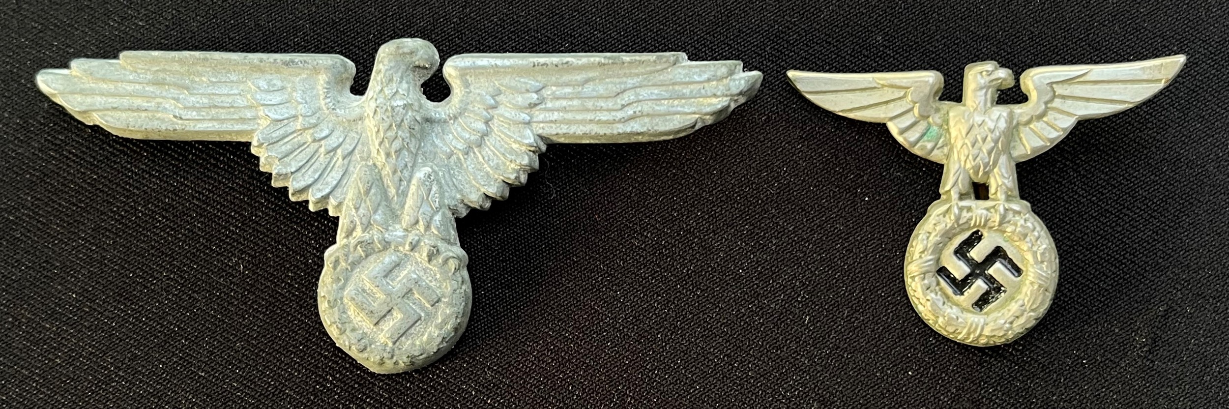 WW2 Third Reich SS Cap eagles: 1936 pattern cap eagle maker marked 55/42, missing one prong along with an early SS cap eagle, no makers marks. War souvenirs of a member of the British Merchant Navy. New to the market. (2)