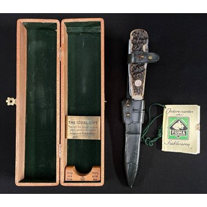 Puma of Solingen Gamekeepers Knife Model No.3591. Handmade Multi blade knife with large single edged blade 110mm in length, blade is marked "Original Waidmesser fur Schalenwild" on one side along with "Puma-Werk, Solingen. Made in Germany. Handarbeit. Bestell-No. 3591". Antler grips which contain a skinning blade 64mm in length, saw blade with bottle opener and screwdriver point 75mm in length, plus a 45mm long spike blade with eye. Grip inset with .800 silver marked escutcheon plate engraved "MJ". Contained in a green leather sheath with belt loop. Come in it's original wooden display box with original paper instruction leaflet.
