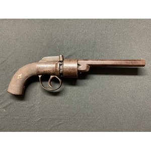 Percussion Cap Revolver with 143mm long barrel. 6 shot cylinder. Bore approx. 9mm. No makers marks. English Proof marks. Double action, working condition. Engraved decoration to receiver, hammer and butt. Overall length 300mm. Section 58 (2) no licence required.